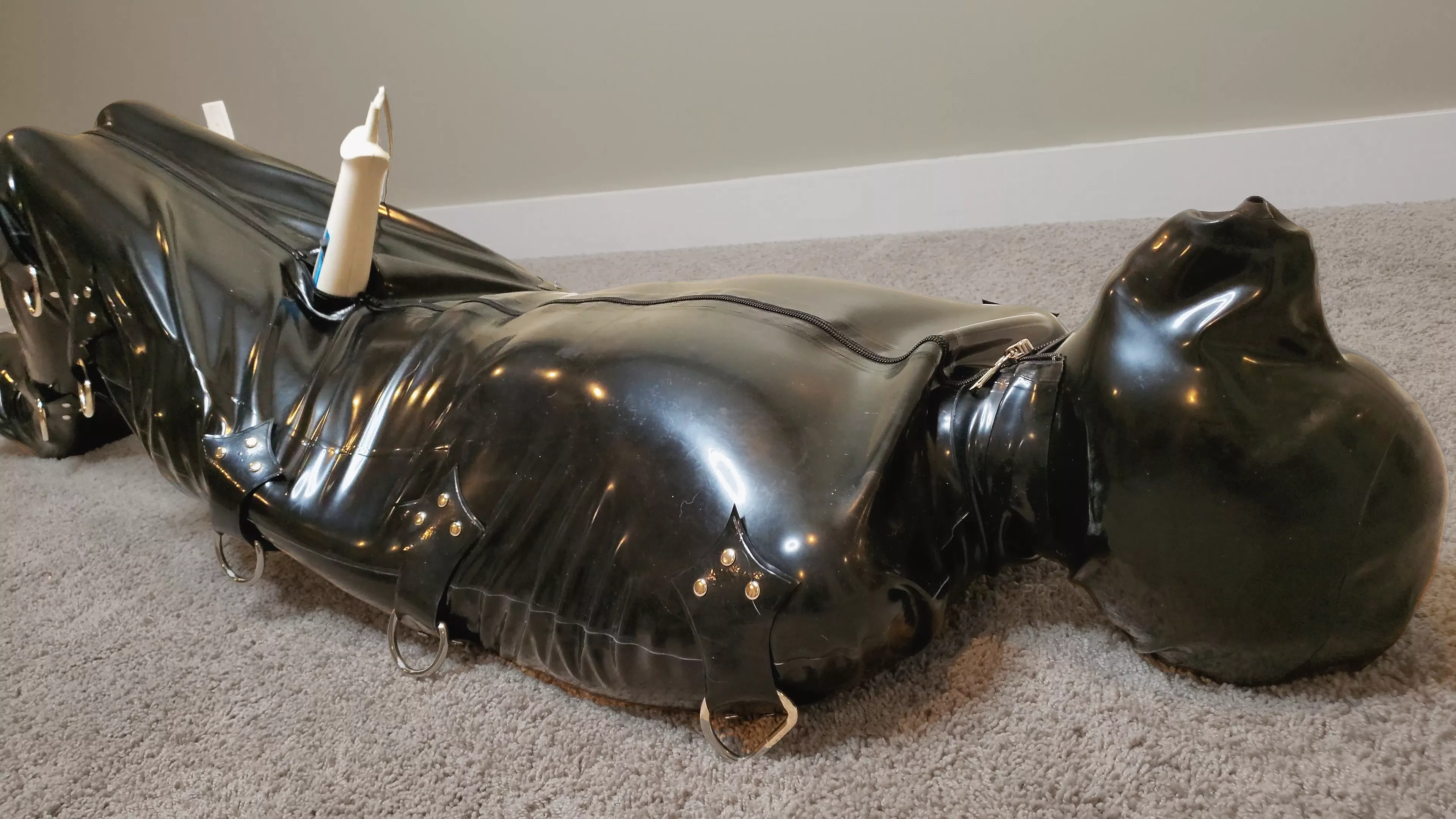 Locked inside a full body sleep sack and rebreather mask being forced to cum