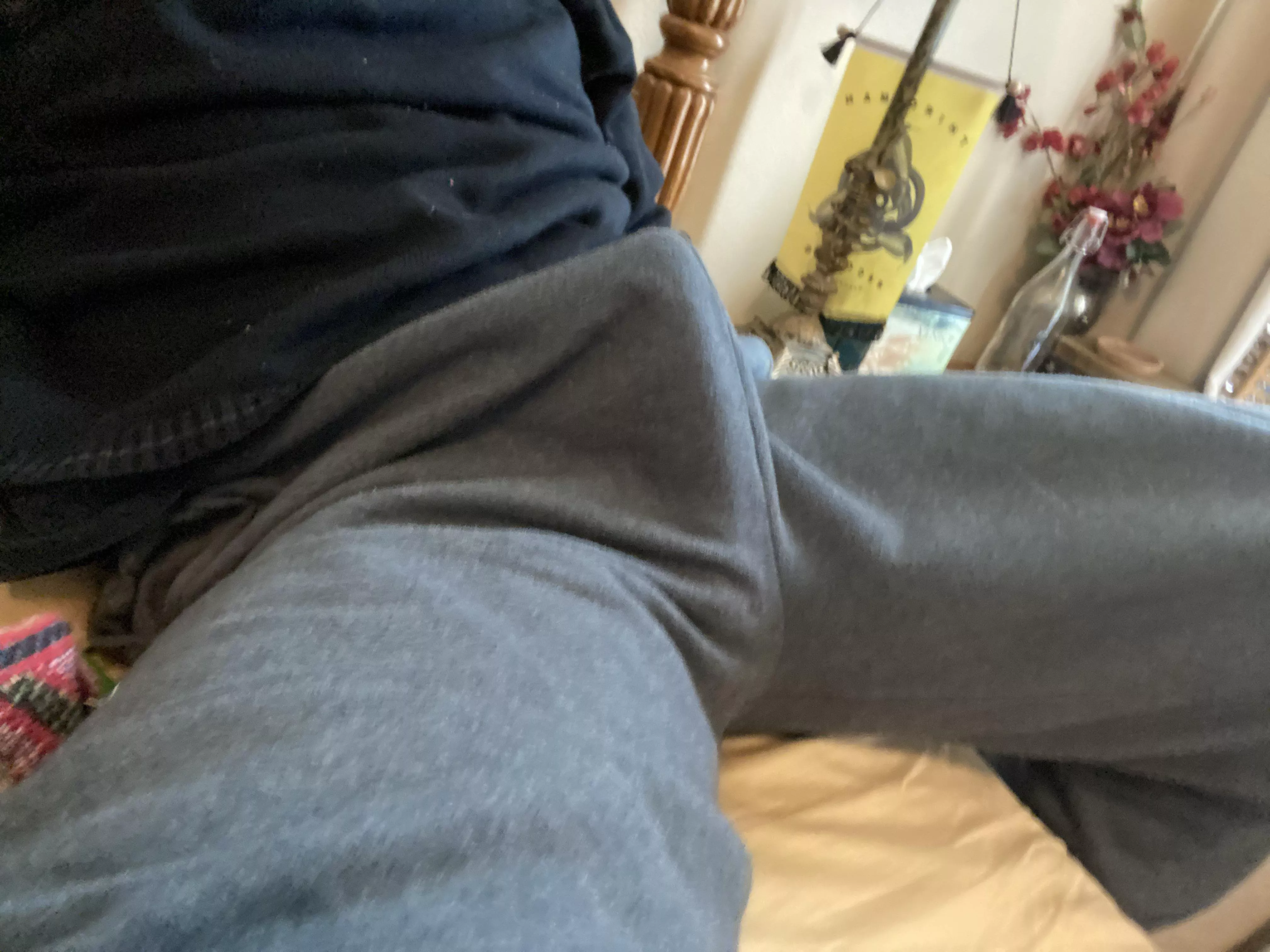 lounging in grey sweatpants