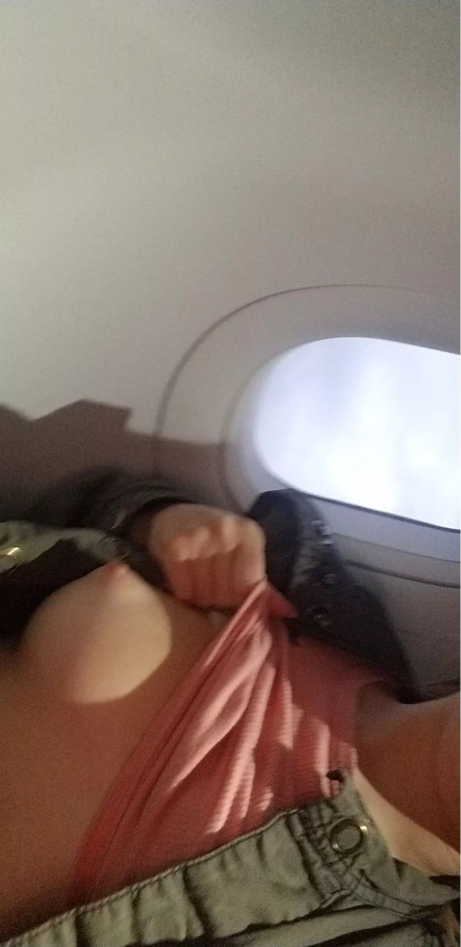 My heart was racing while I was flashing a titty on this very crowded flight!