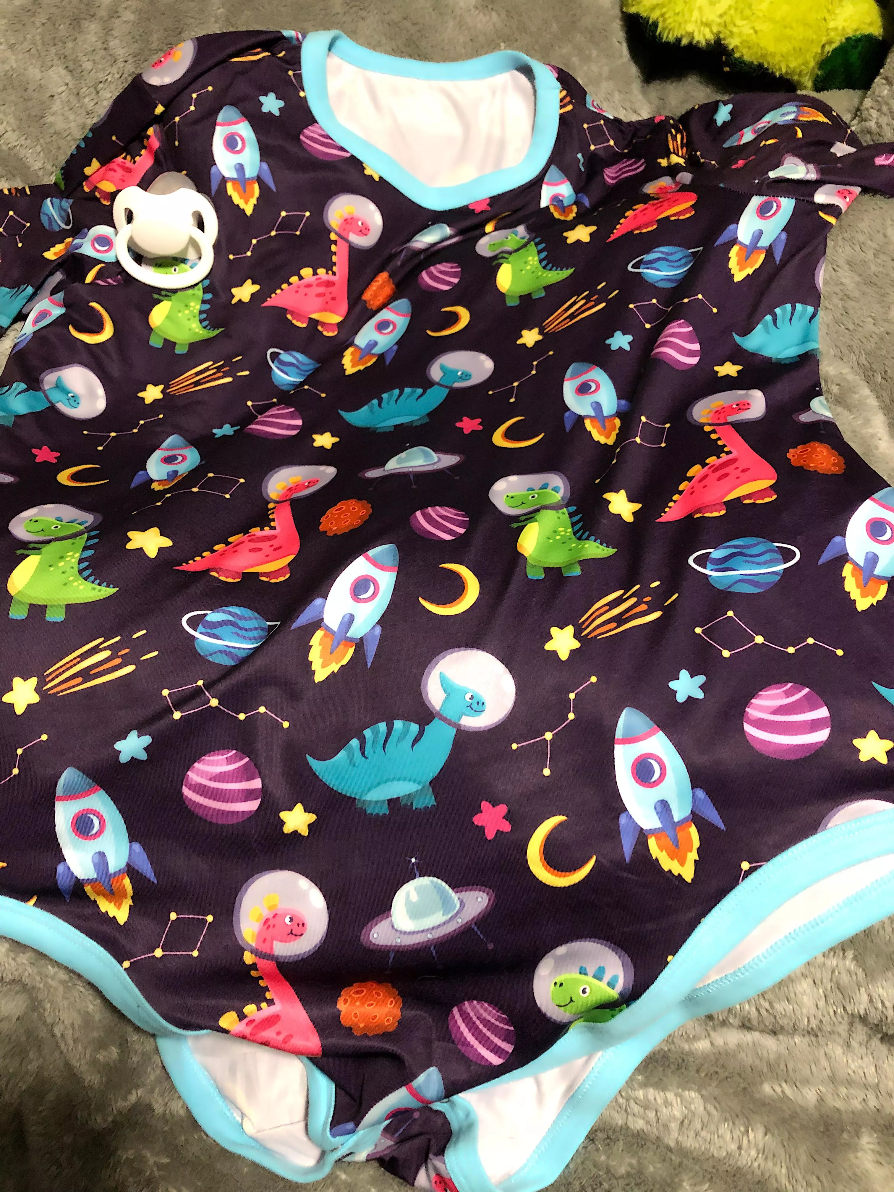 Onesie of the day. Dino’s in space!!!