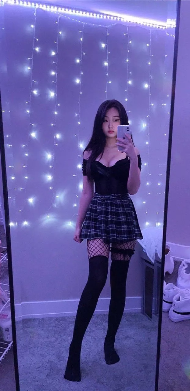 Pleated skirt and thigh high socks