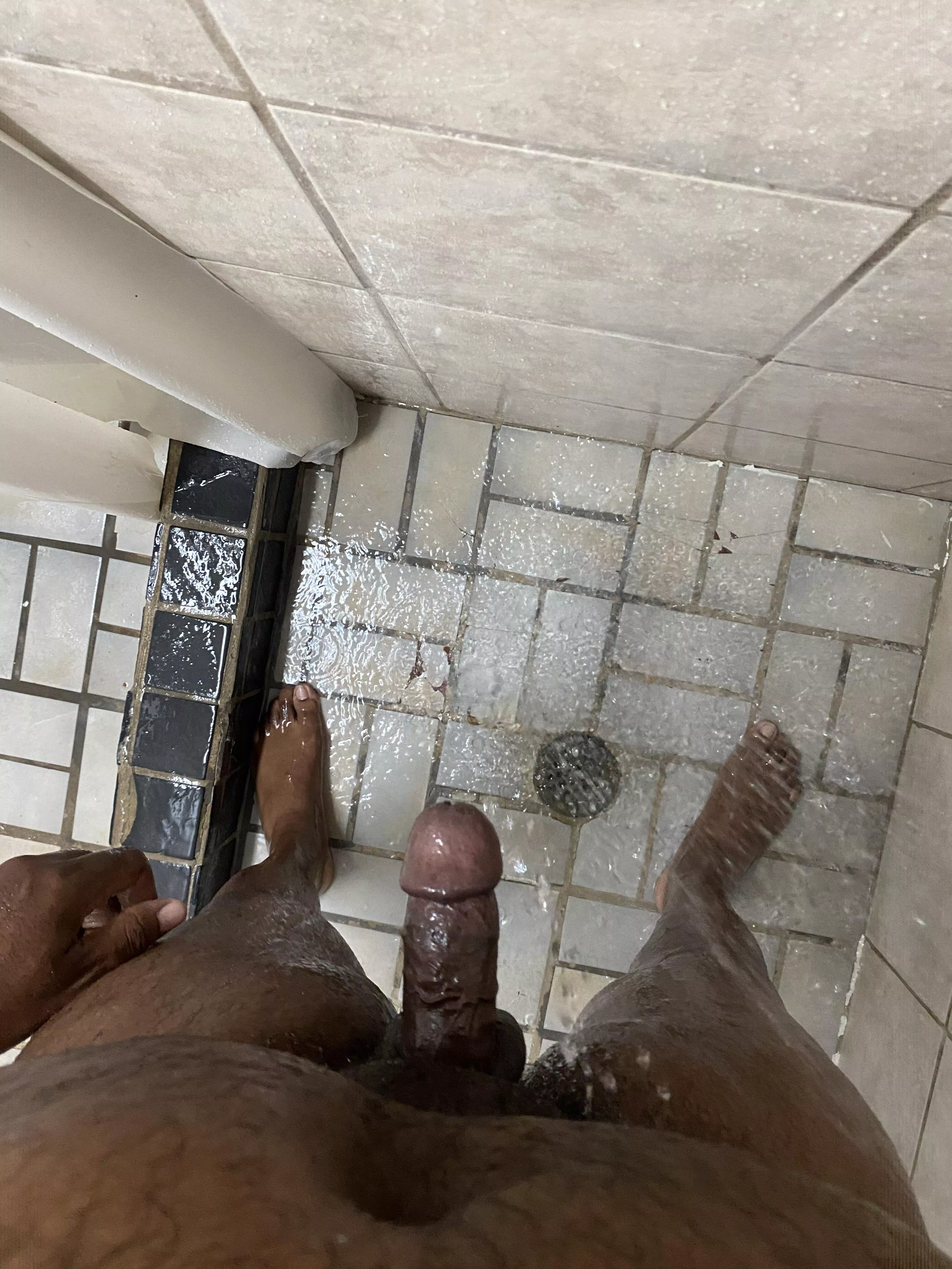 Public shower, curtain open, dick on brick