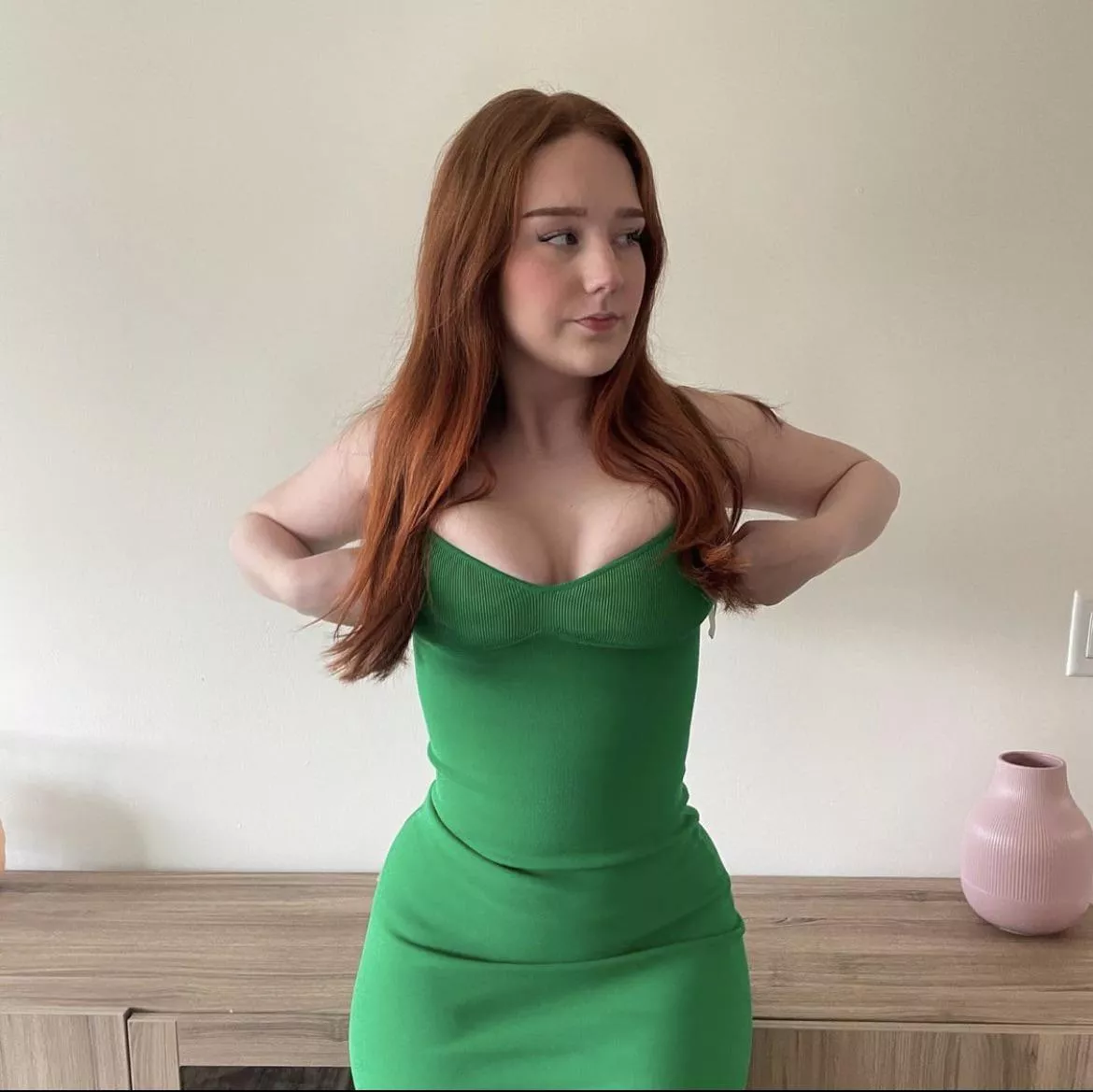 Redhead in a tight green dress