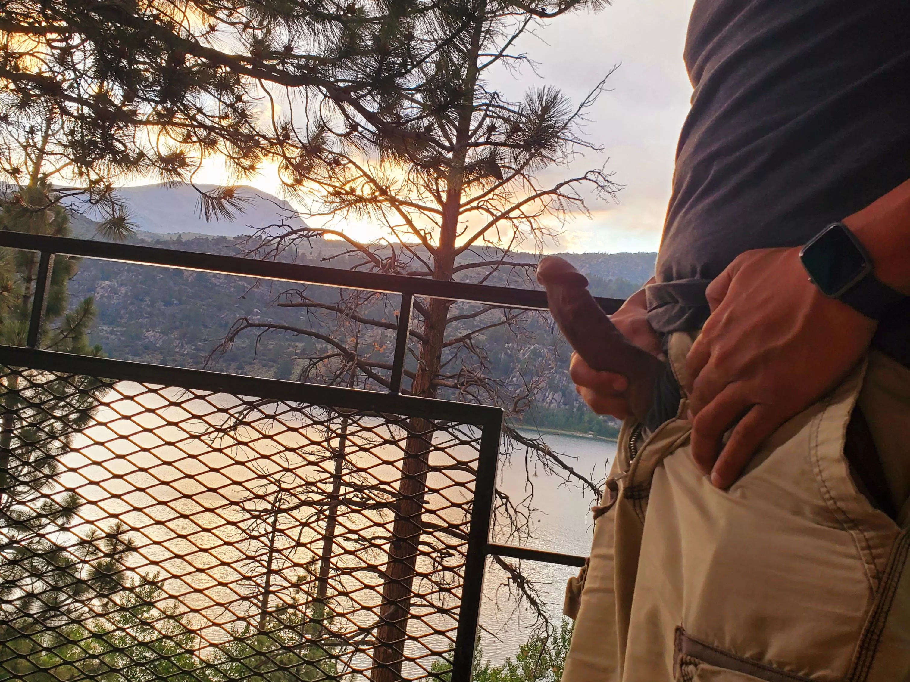 Releasing morning wood on a hotel balcony.