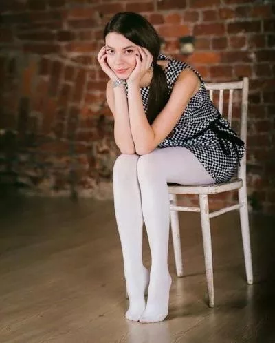 Shoeless in white opaque tights