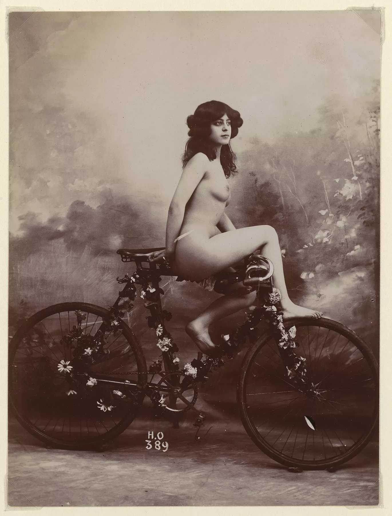 Sir, It is often said that women do not like the hobby of bicycling. I wholeheartedly disagree with this false statement. Here we can clearly see one who is getting much pleasure from her velocipede.