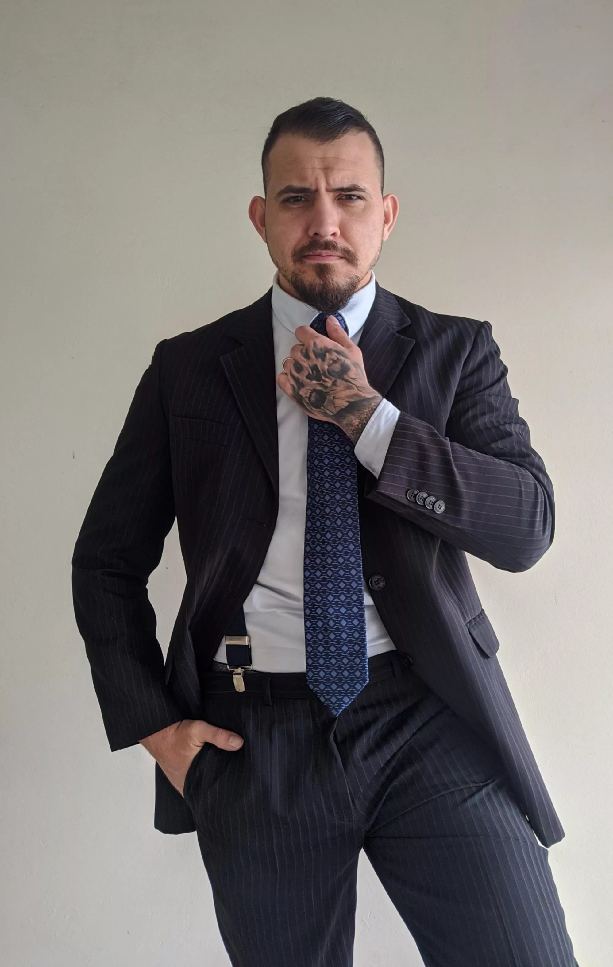 Someone to see the tattoos behind the suit?