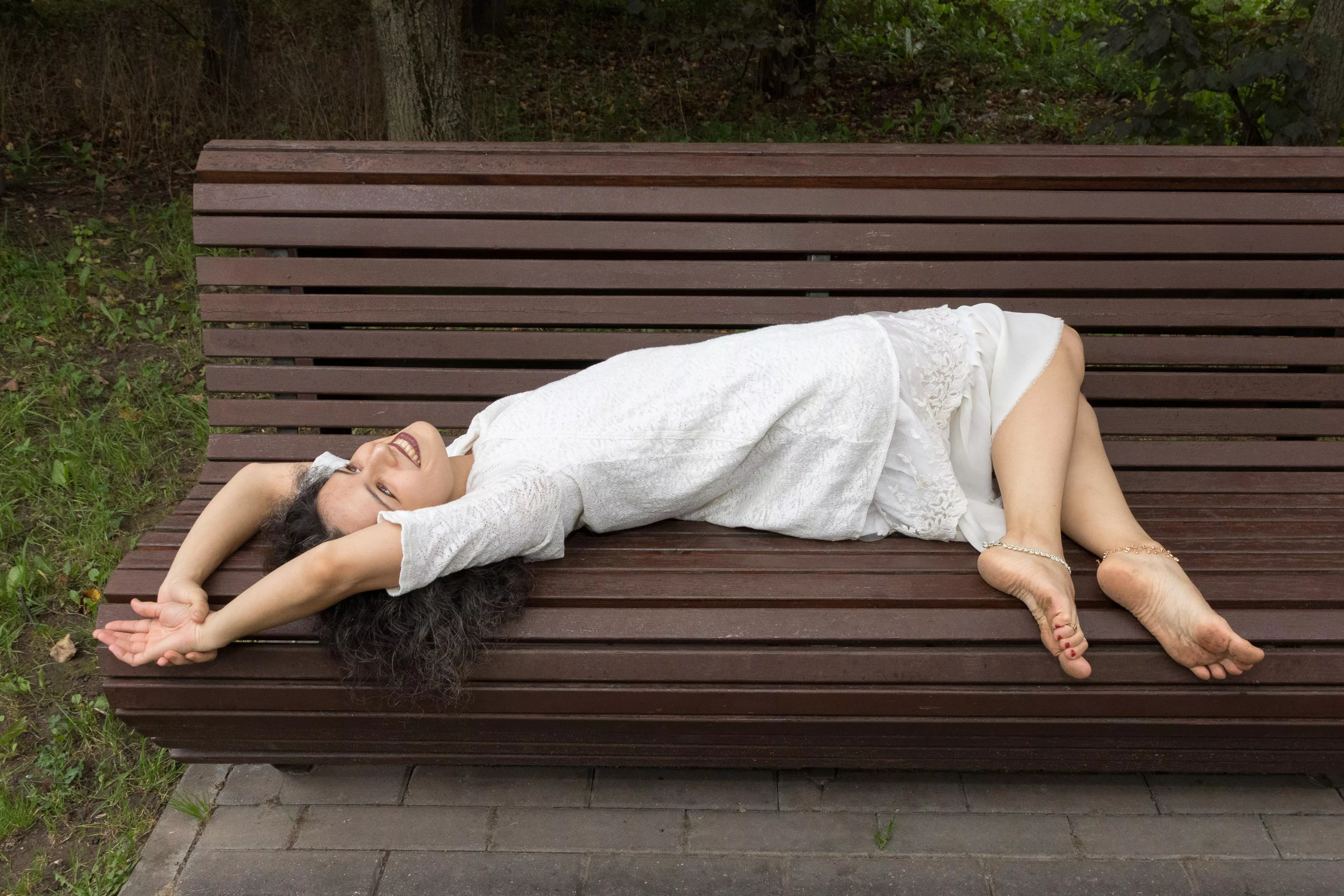 Sometimes in the park you can meet a barefoot girl on a bench