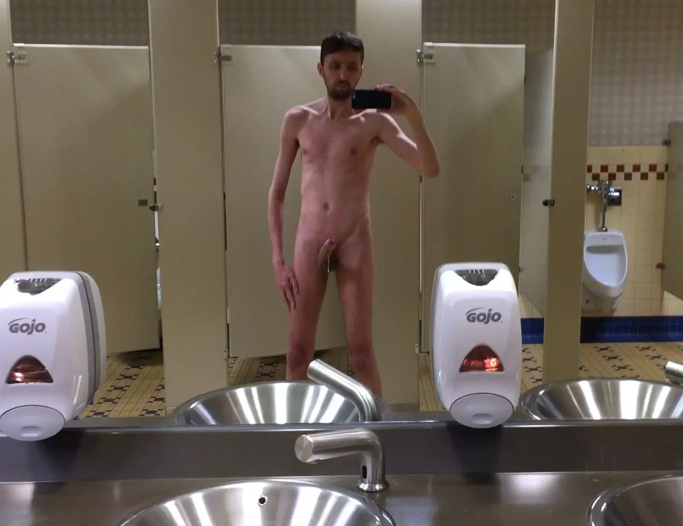 Stripped down in the work bathroom