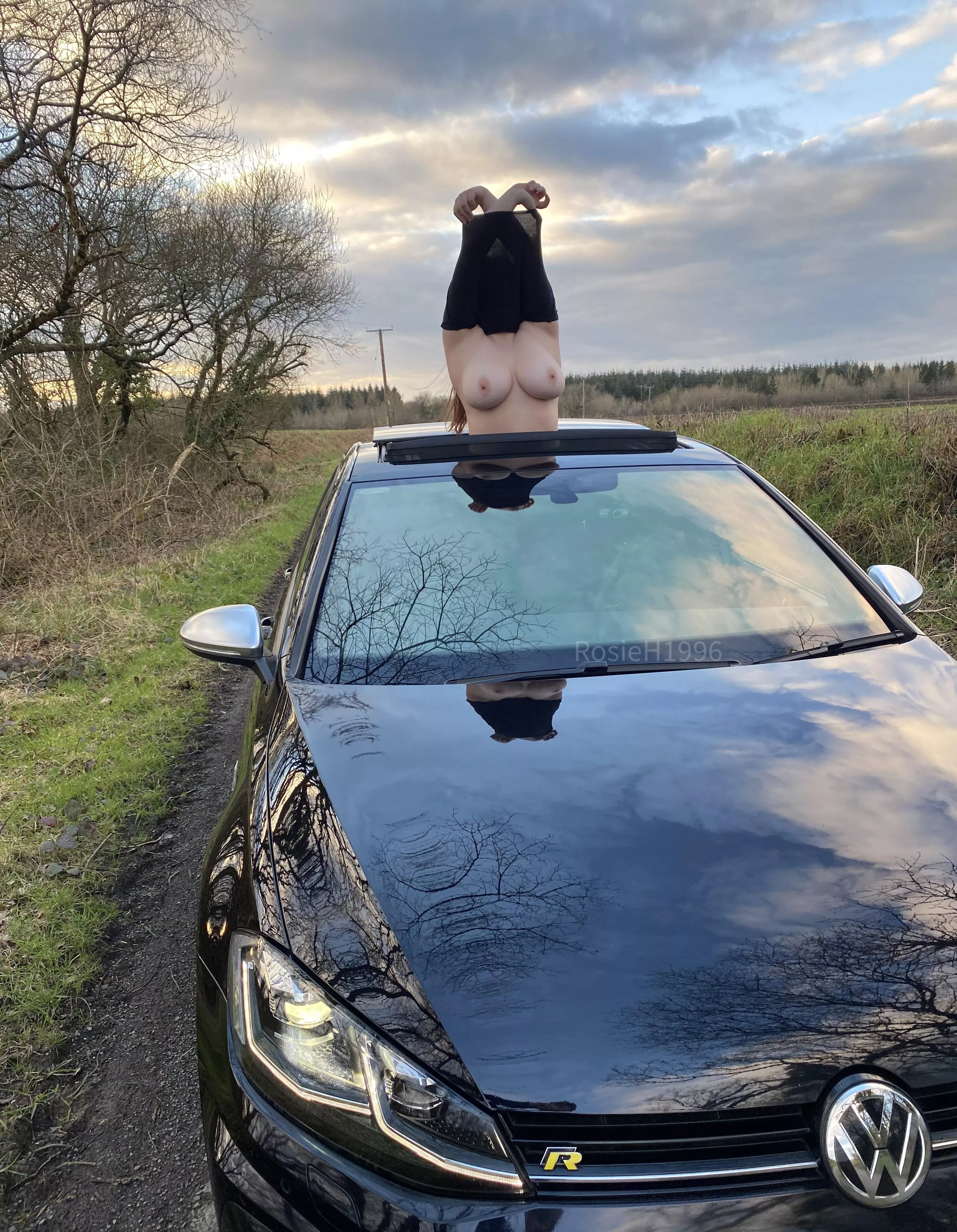 Suns out means only one thing… sunroof open and tits out