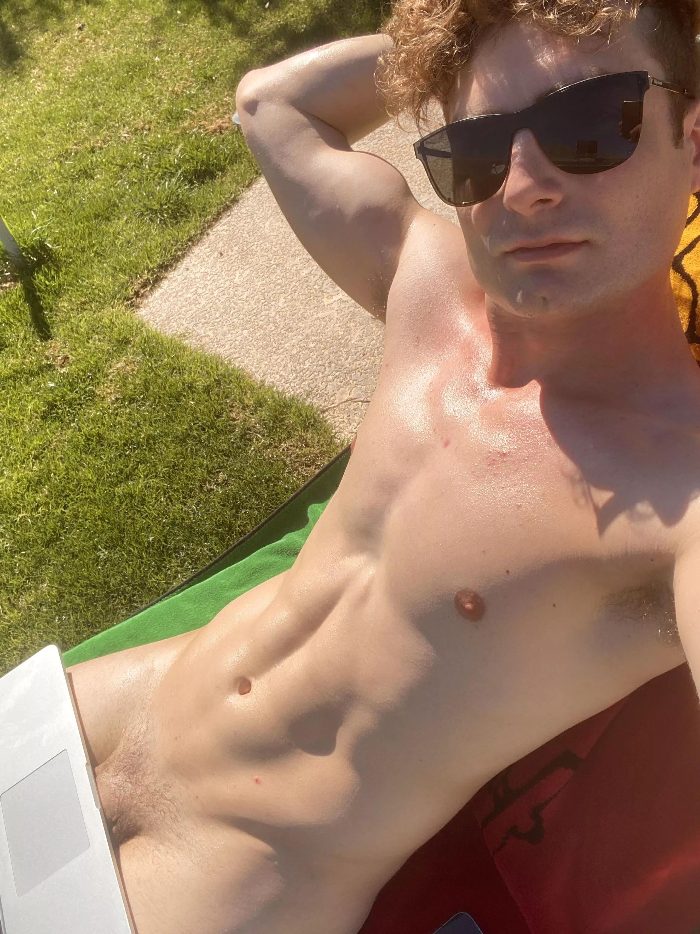 Tanning naked and getting some work done. Hope the neighbors don't mind