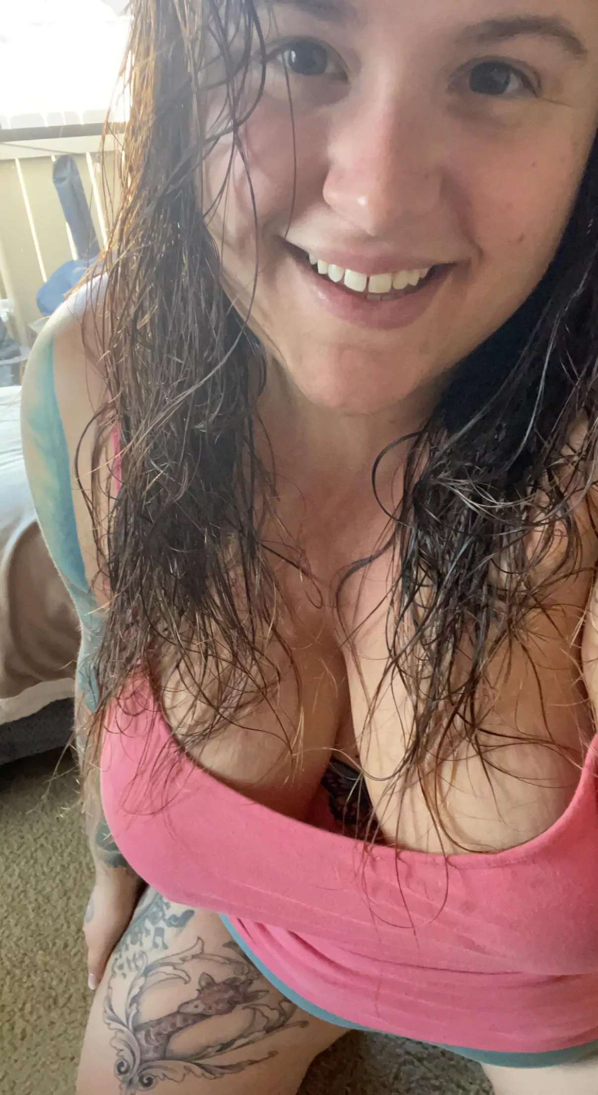 tattooed all natural stoner with big boobs and a seductive smile