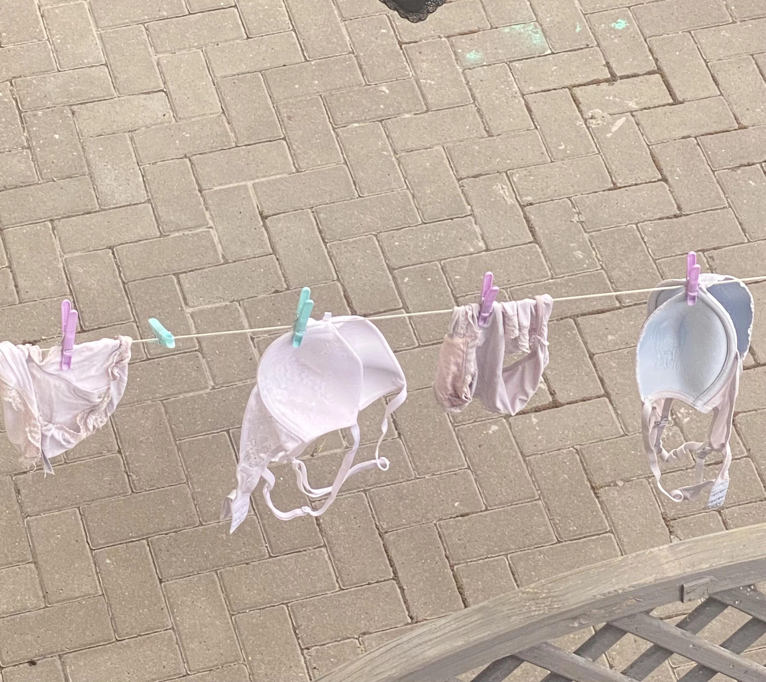 Teasing neighbour loves to show her bra and panties on the washing line