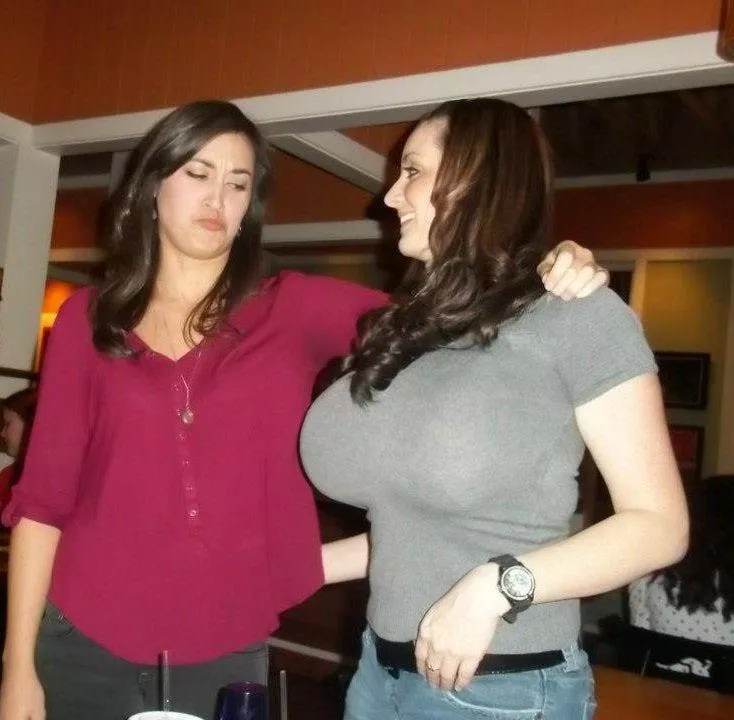 The envying disgust on her face of the others large boobs