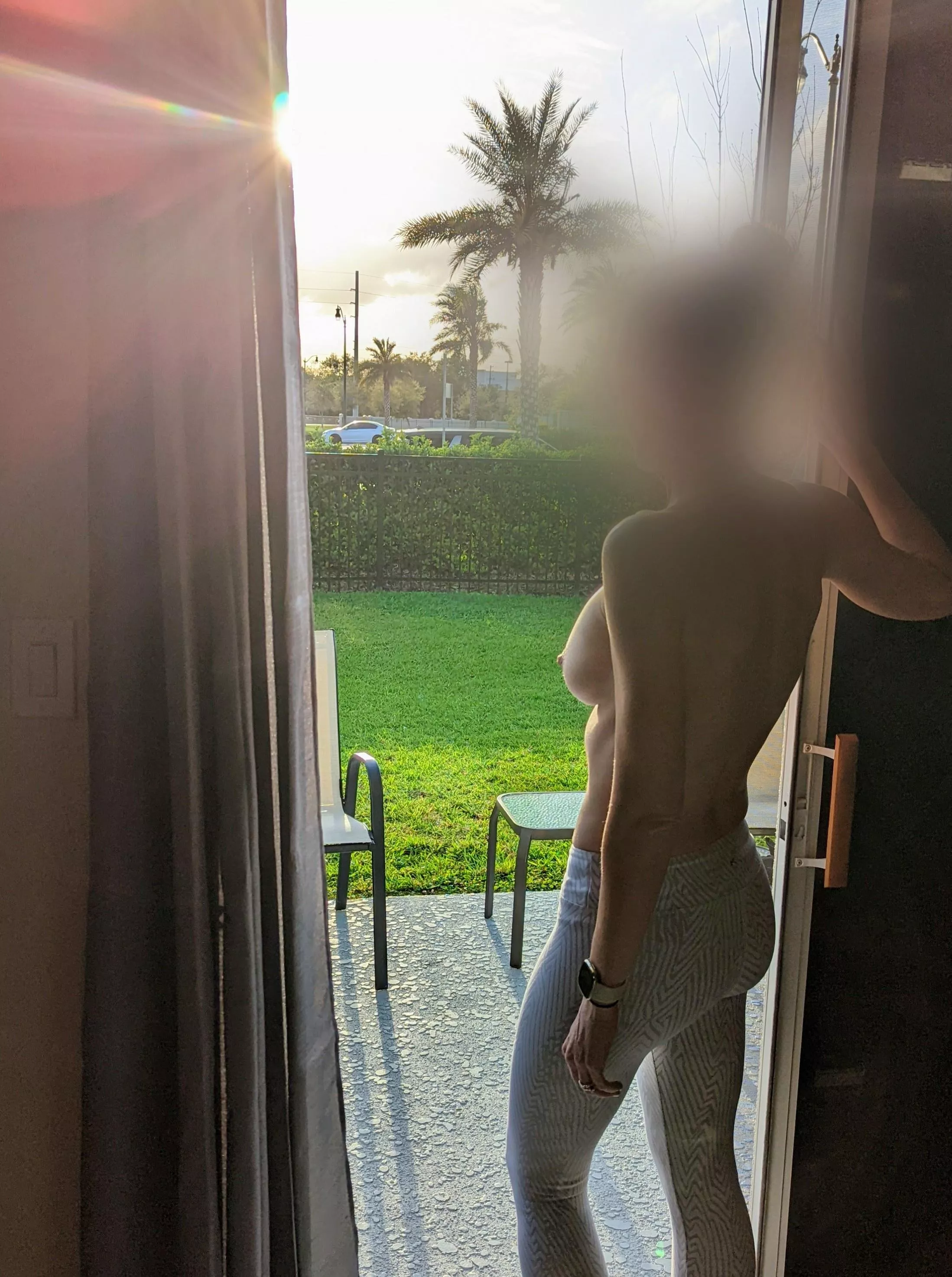 Topless at our Airbnb with cars driving by