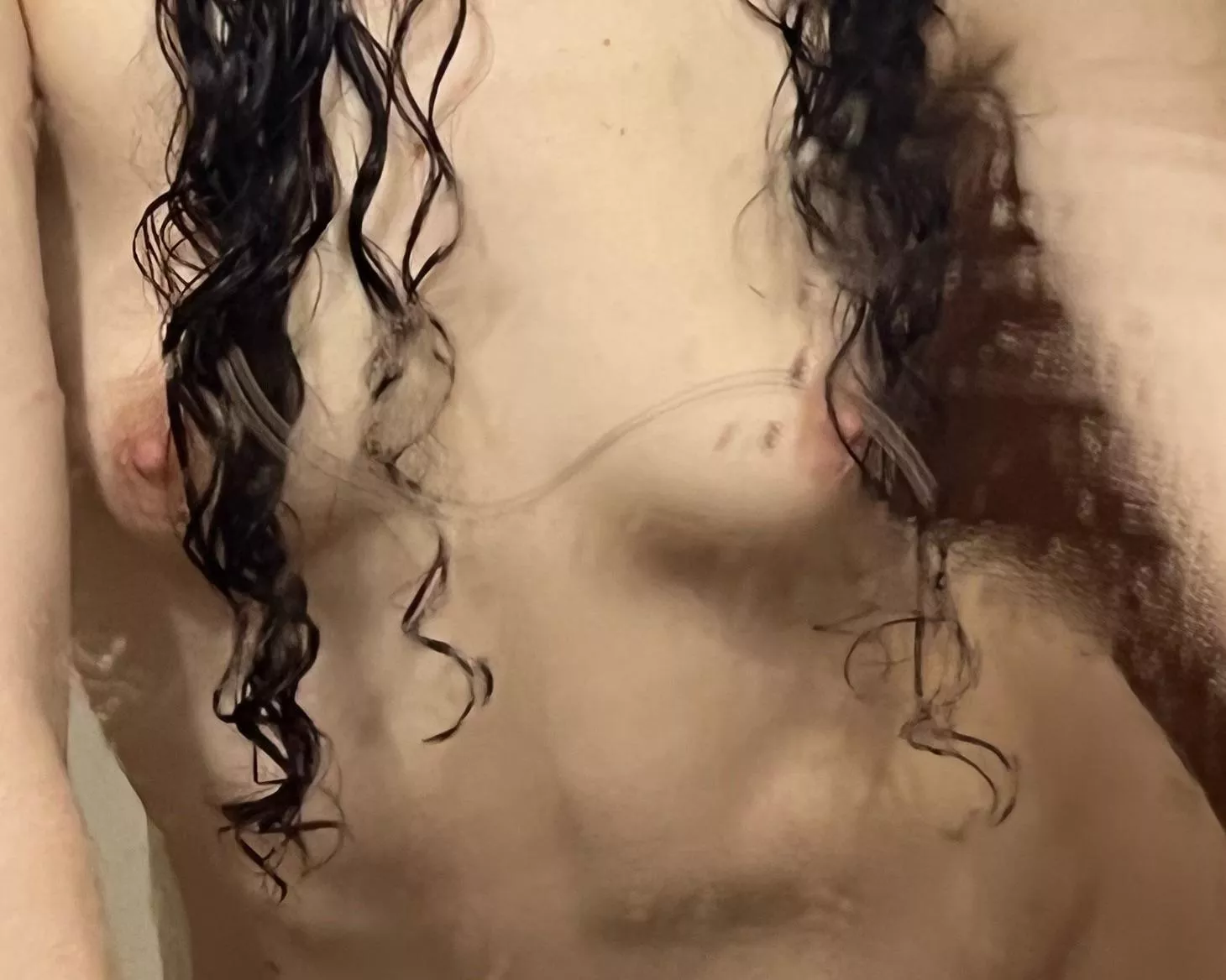 Wet tits and curly hair. Isn't it a winning combo?