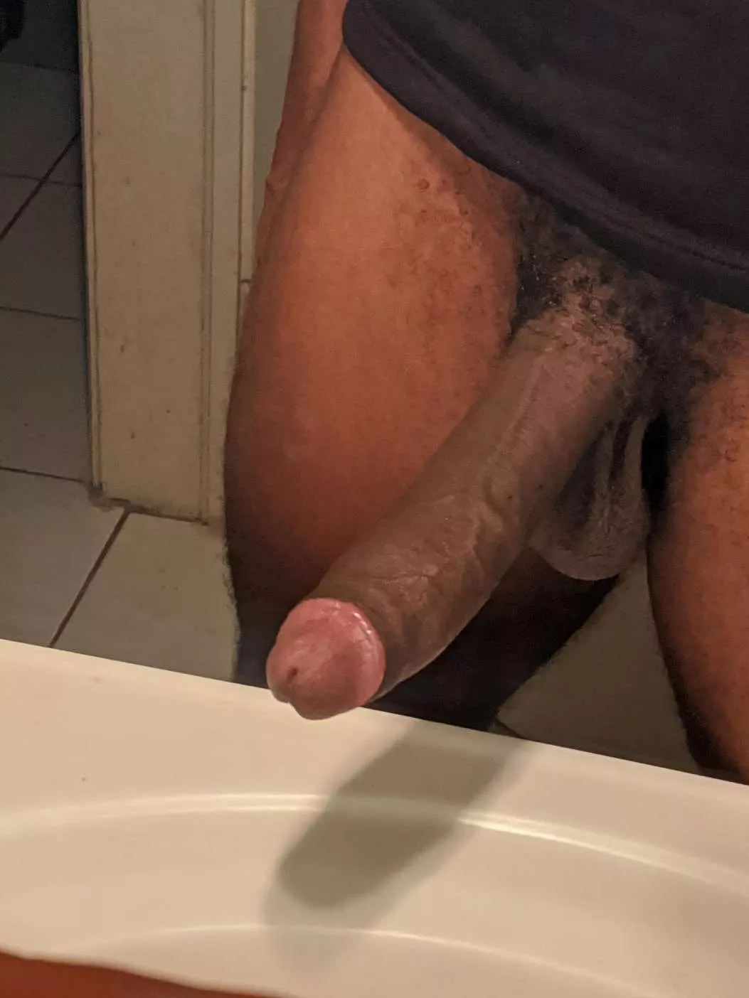 What you doing if you see these black cock n balls poke hang through a gloryhole?