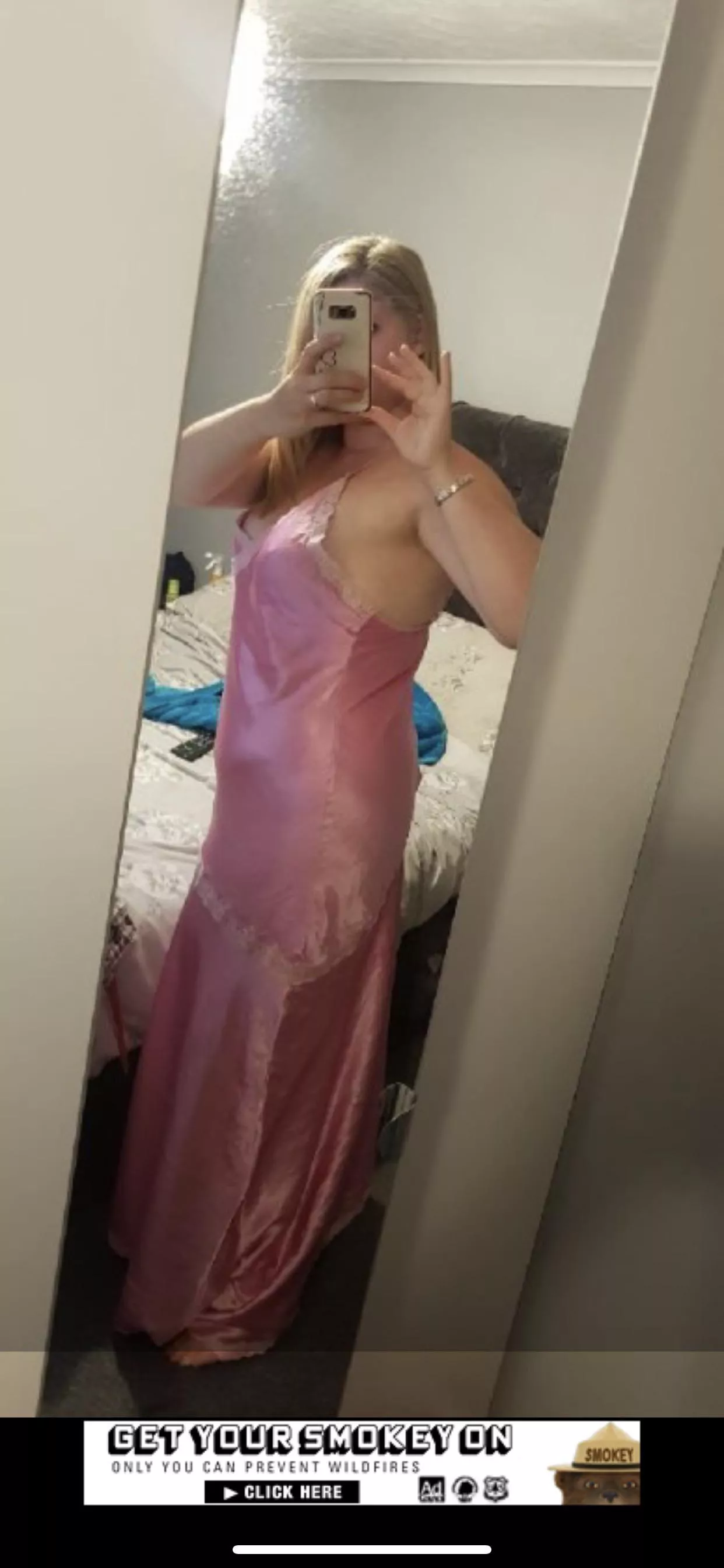 Woman in satin pink nightdress