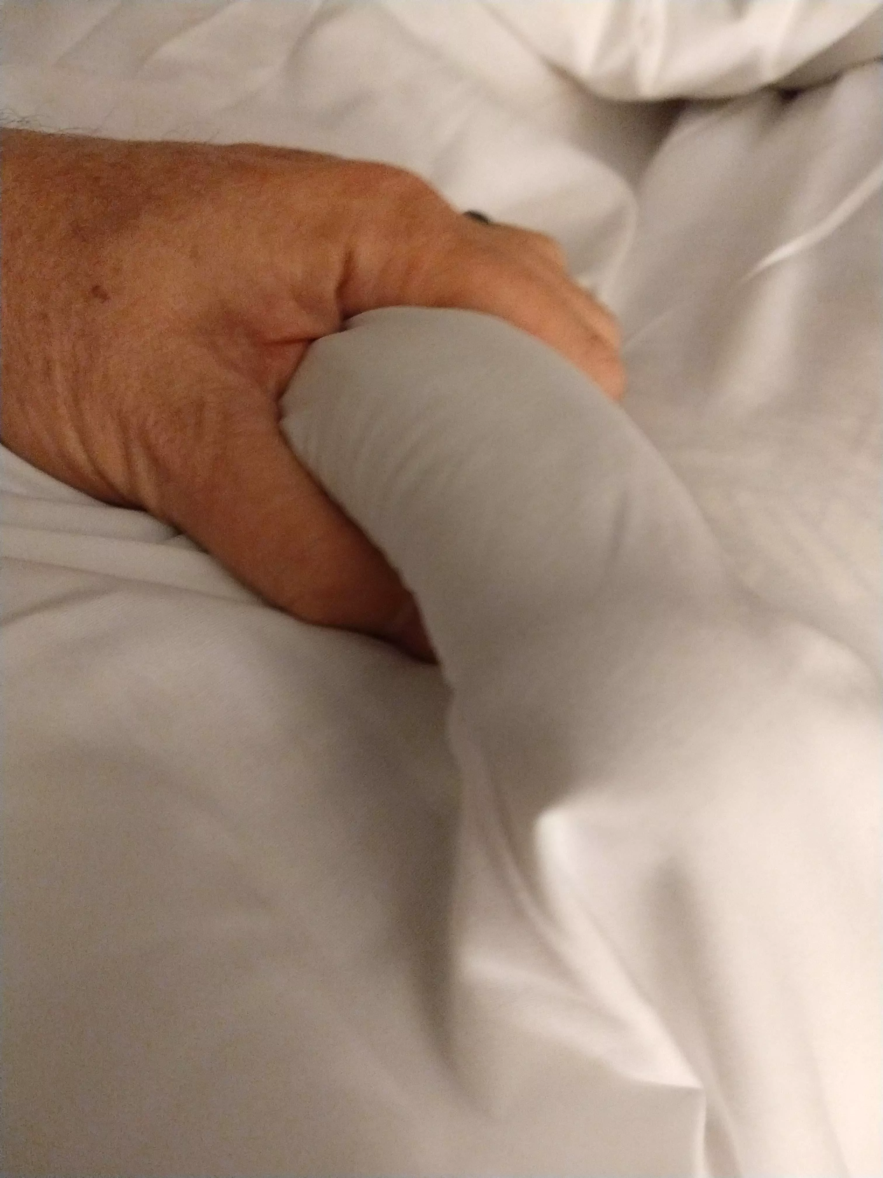 [58] Another hotel bed pic of my old thick cock under the sheets.