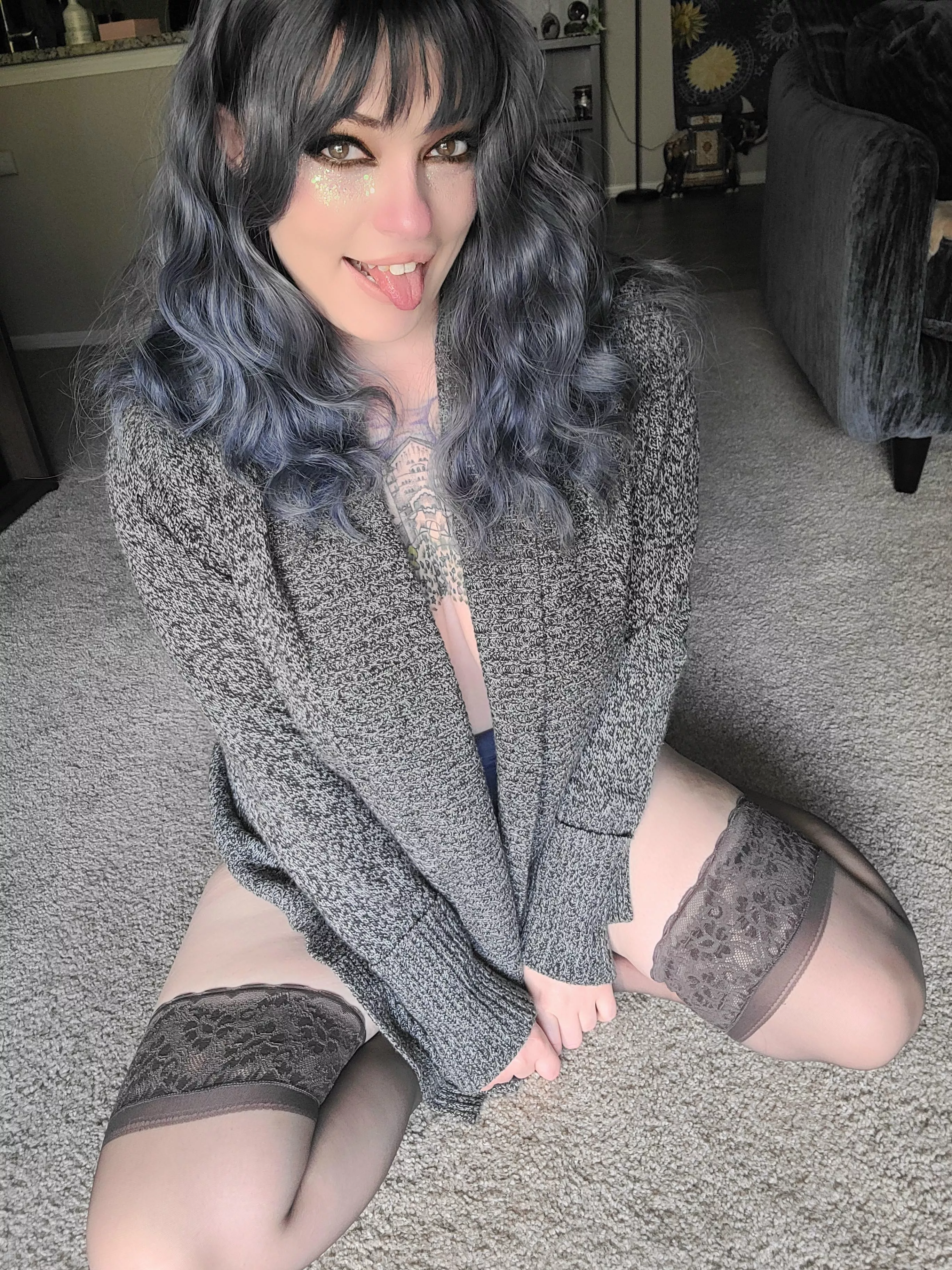 A cozy sweater and sheer thigh highs