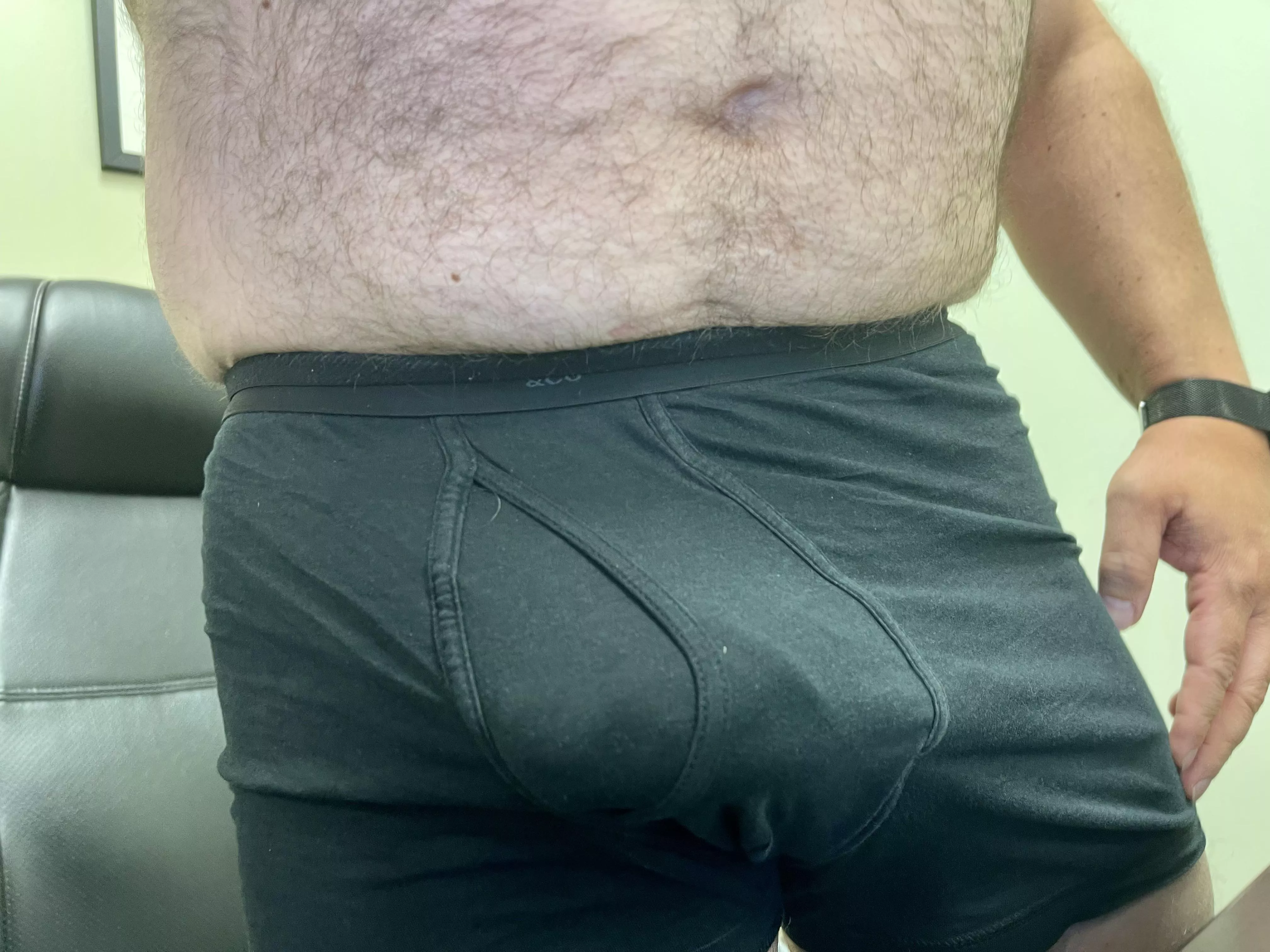 A dad with a dad-bod and a bulge.