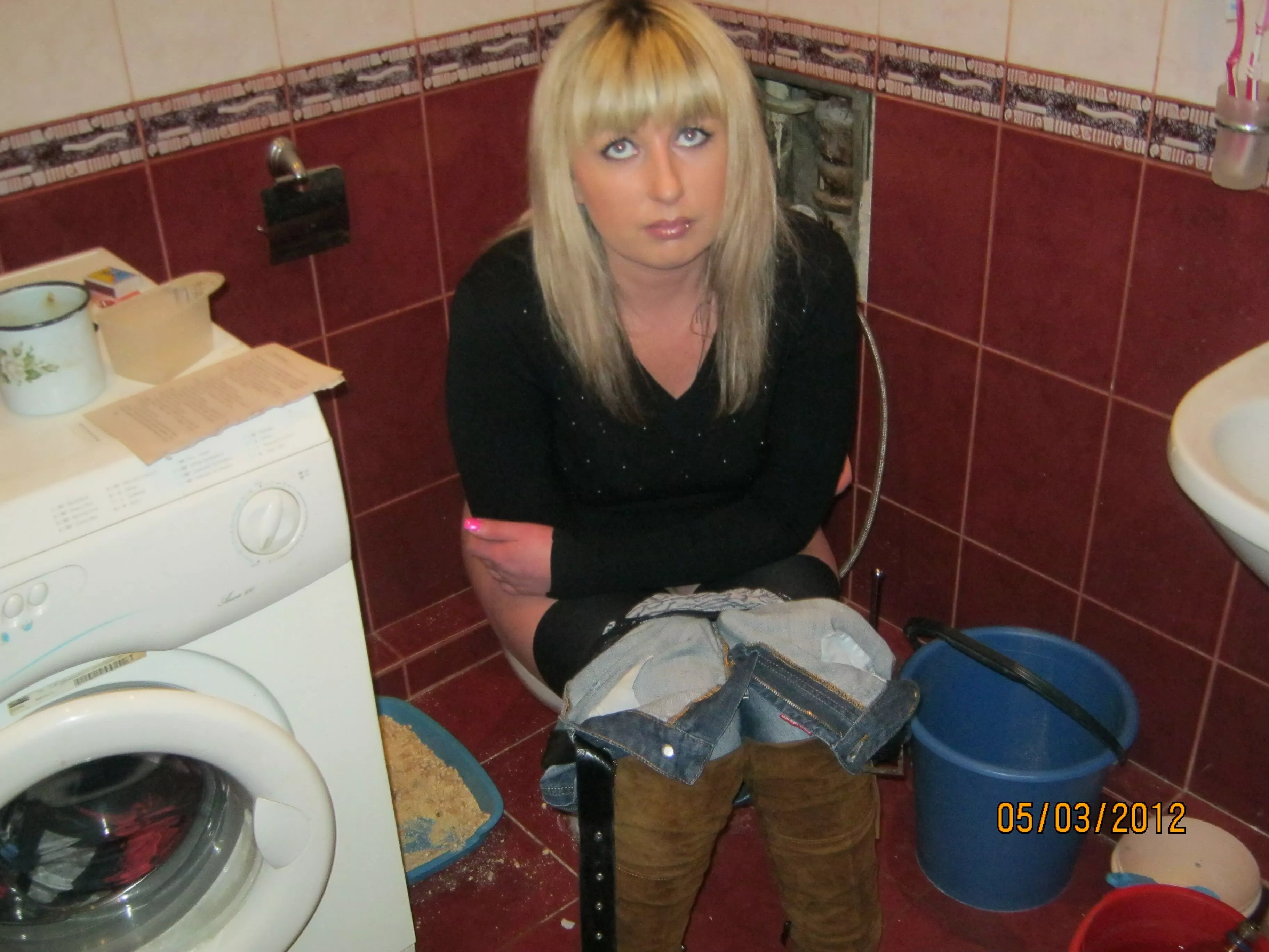 A toilet in the laundry room