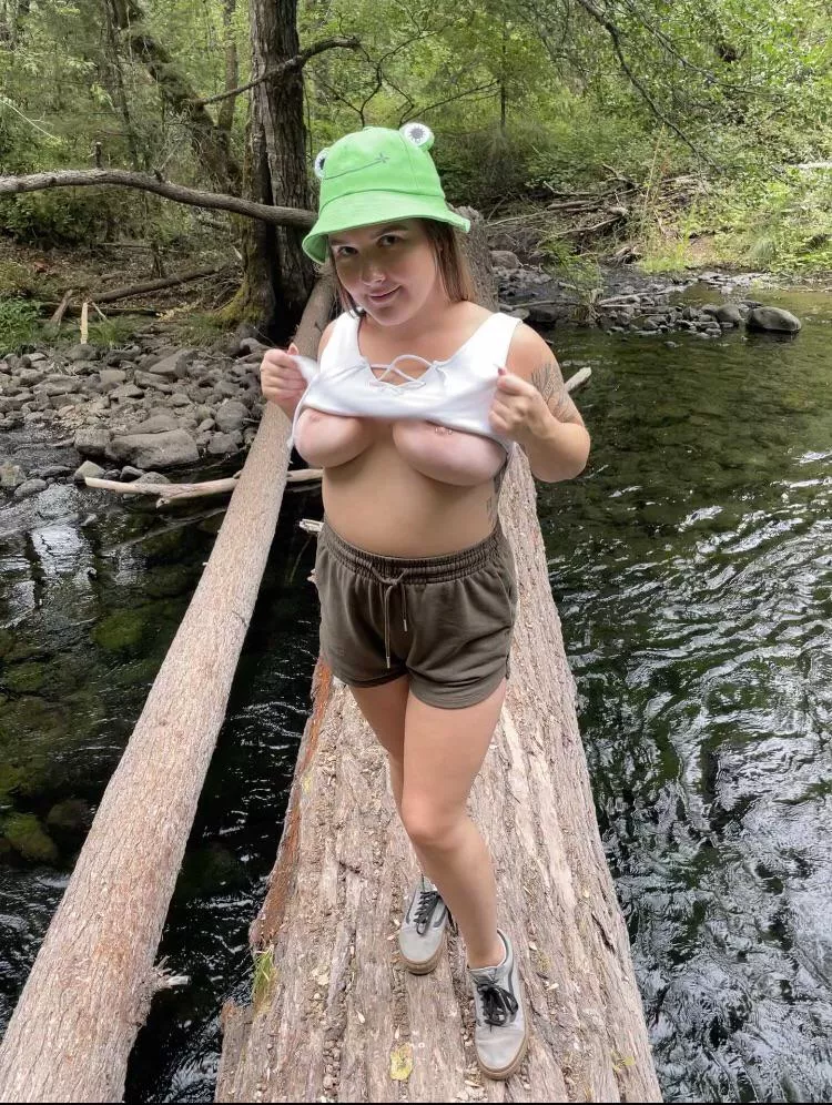 A topless froggy frolicking the woods