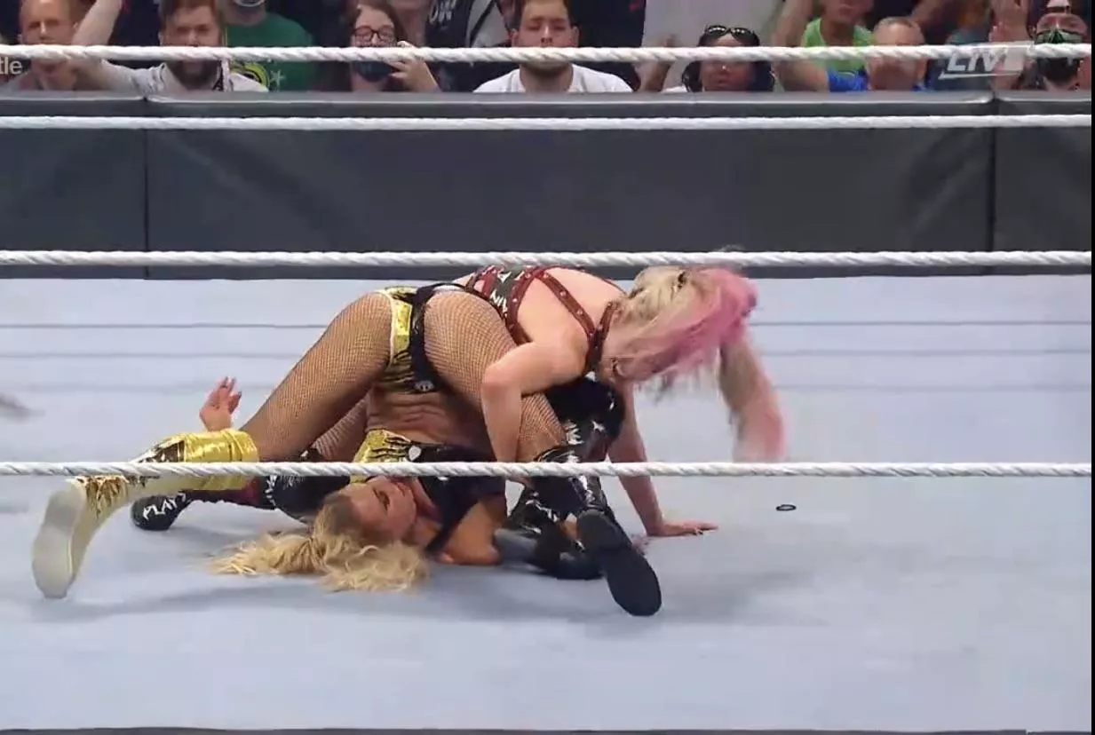 Alexa Bliss opening Charlotte’s legs wide open