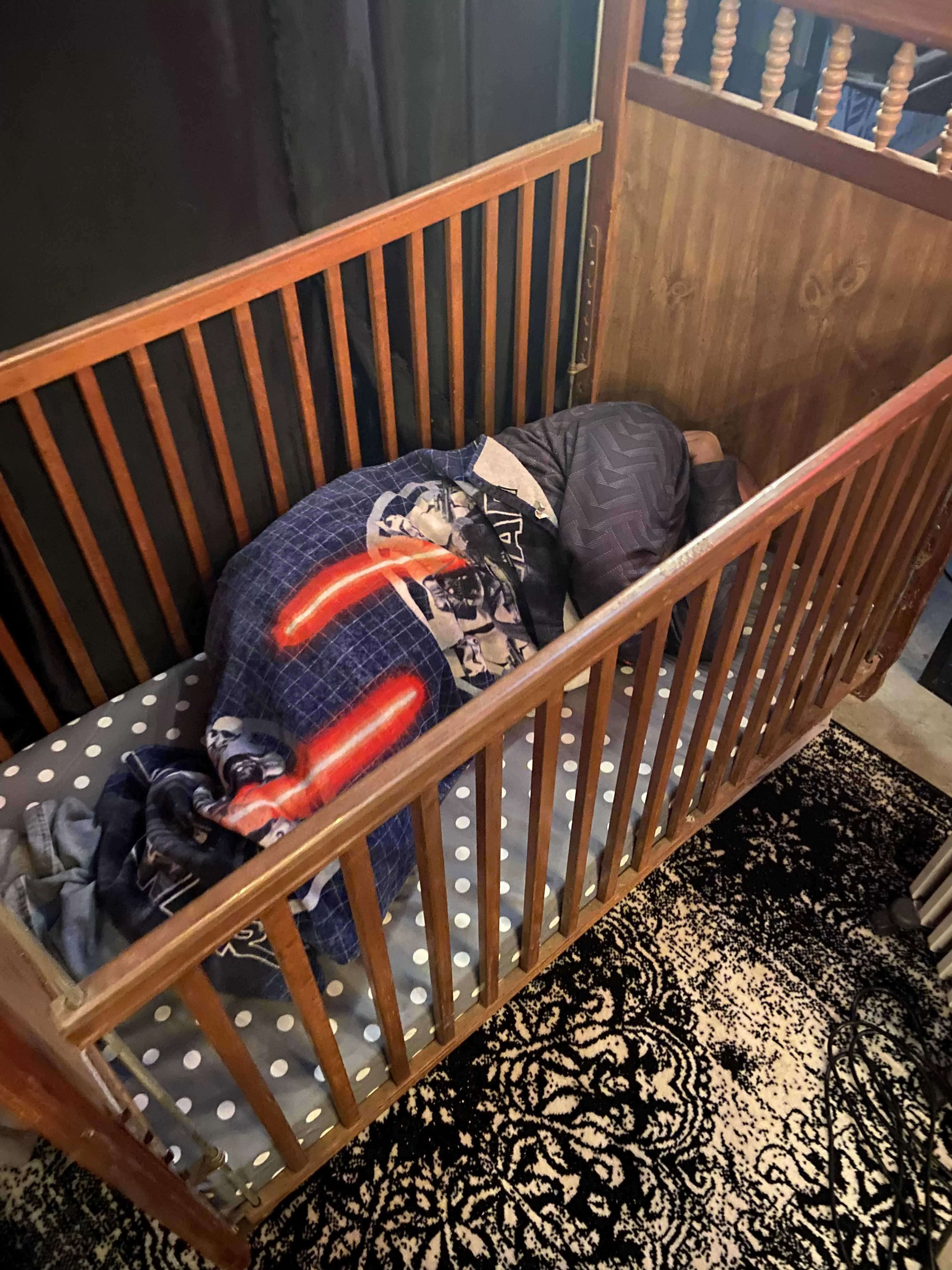 Baby boy taking a nap in the new crib.