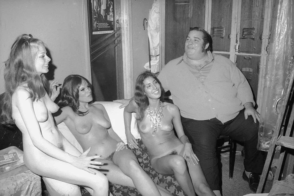 'Big' Davey Rosenberg sits with three unidentified dancers backstage at the Condor Club, San Francisco, August 1972