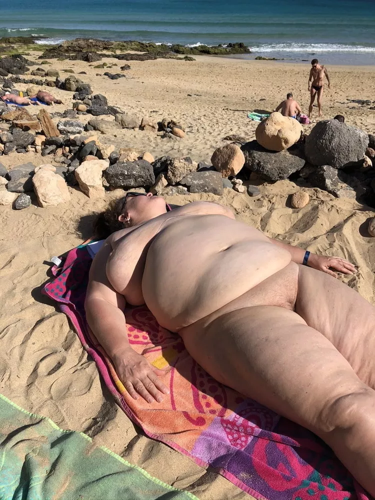 Big gal laying out in the nude beach