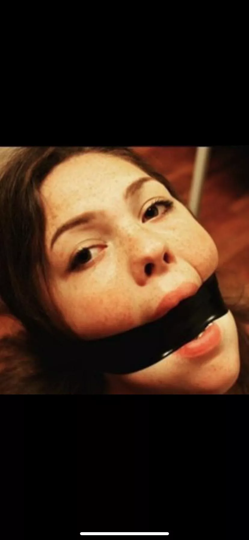 Black tape gagged