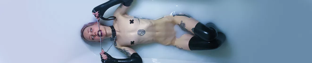 Blind, leashed, and latex-clad in a milk bath