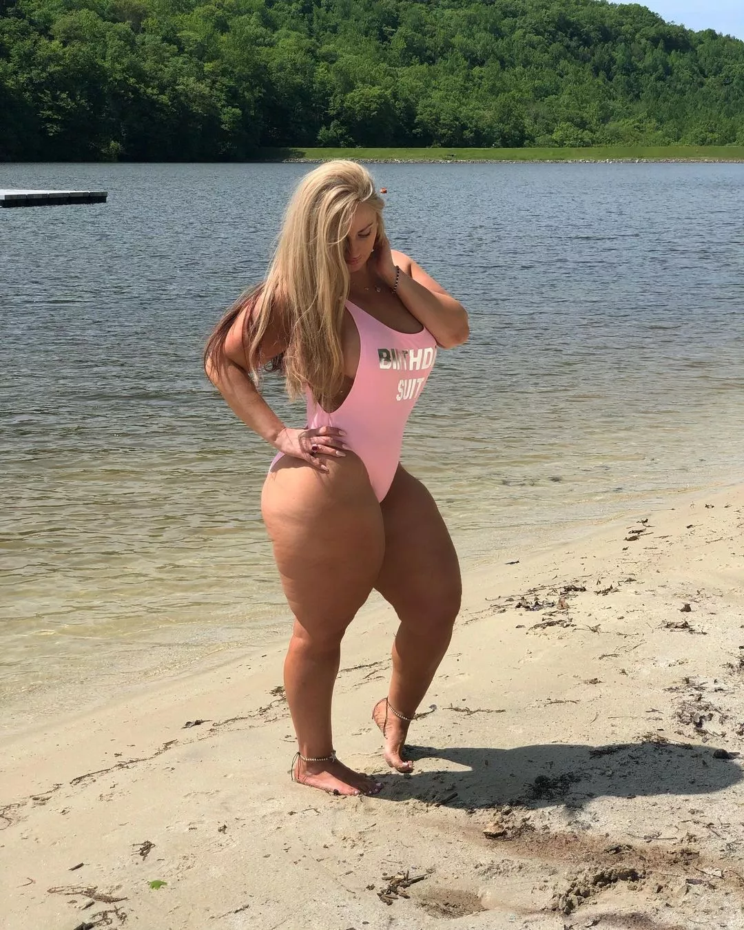 Blonde with thick thighs in a pink one-piece