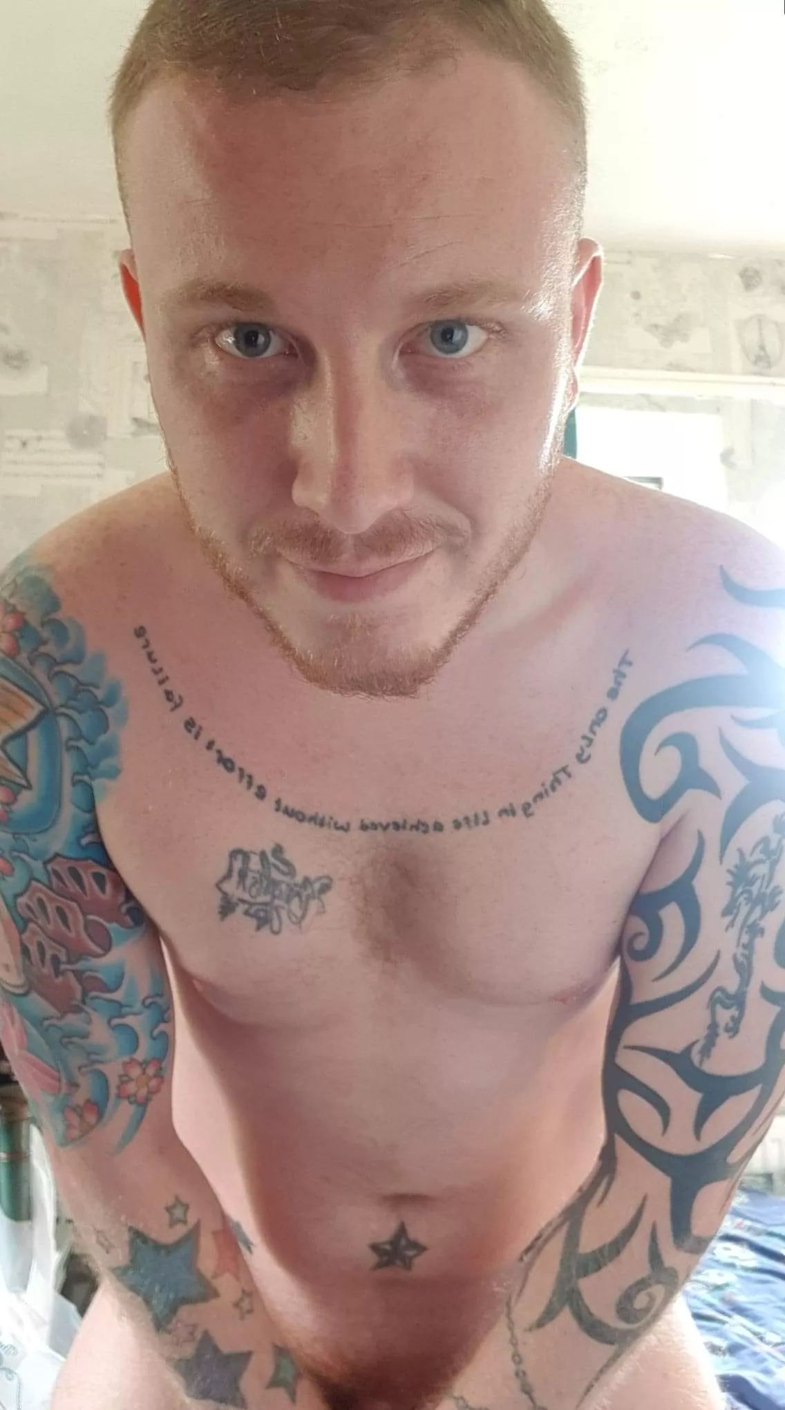 Blue eyed ginger with tattoos