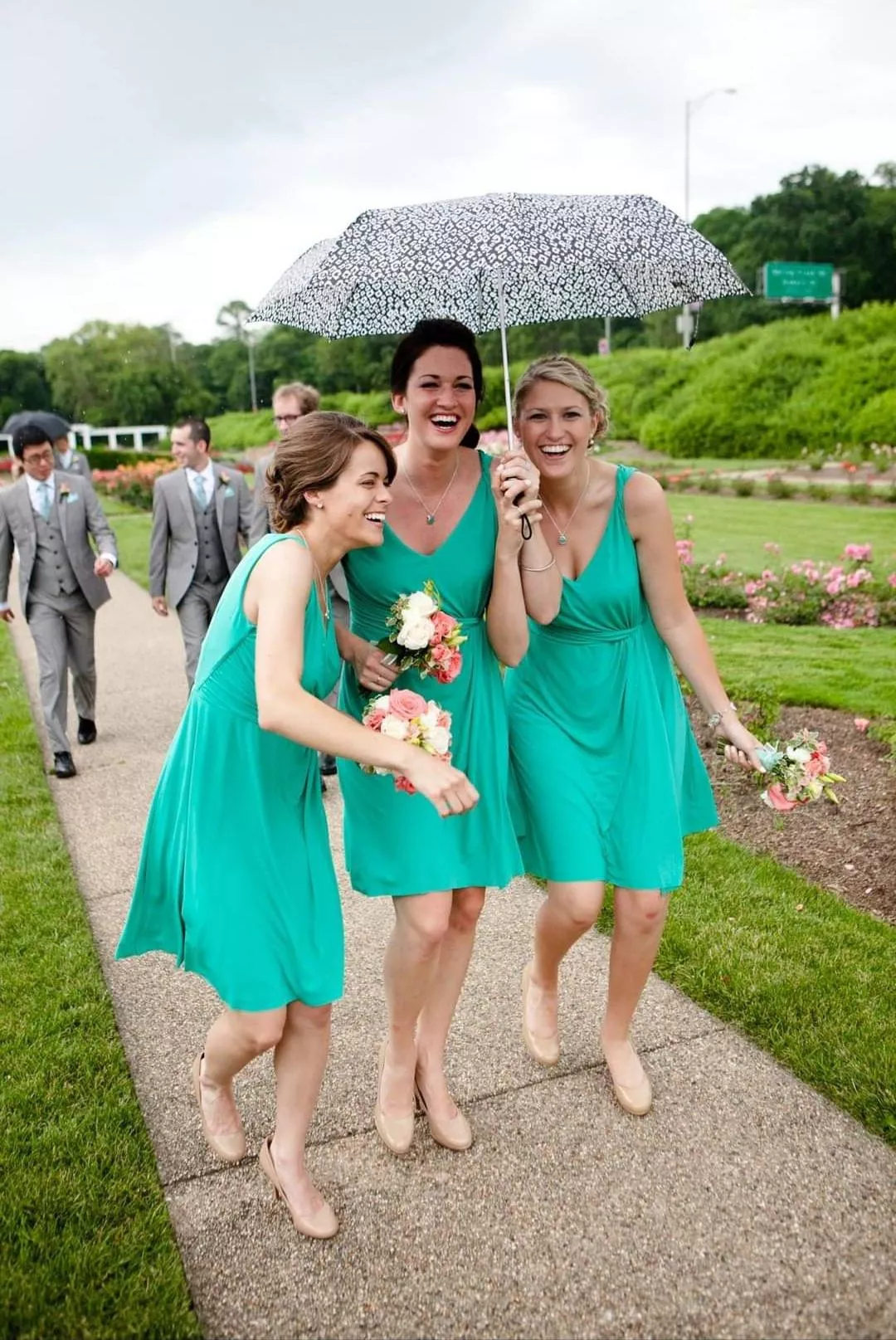 Bridesmaids avoiding the rain