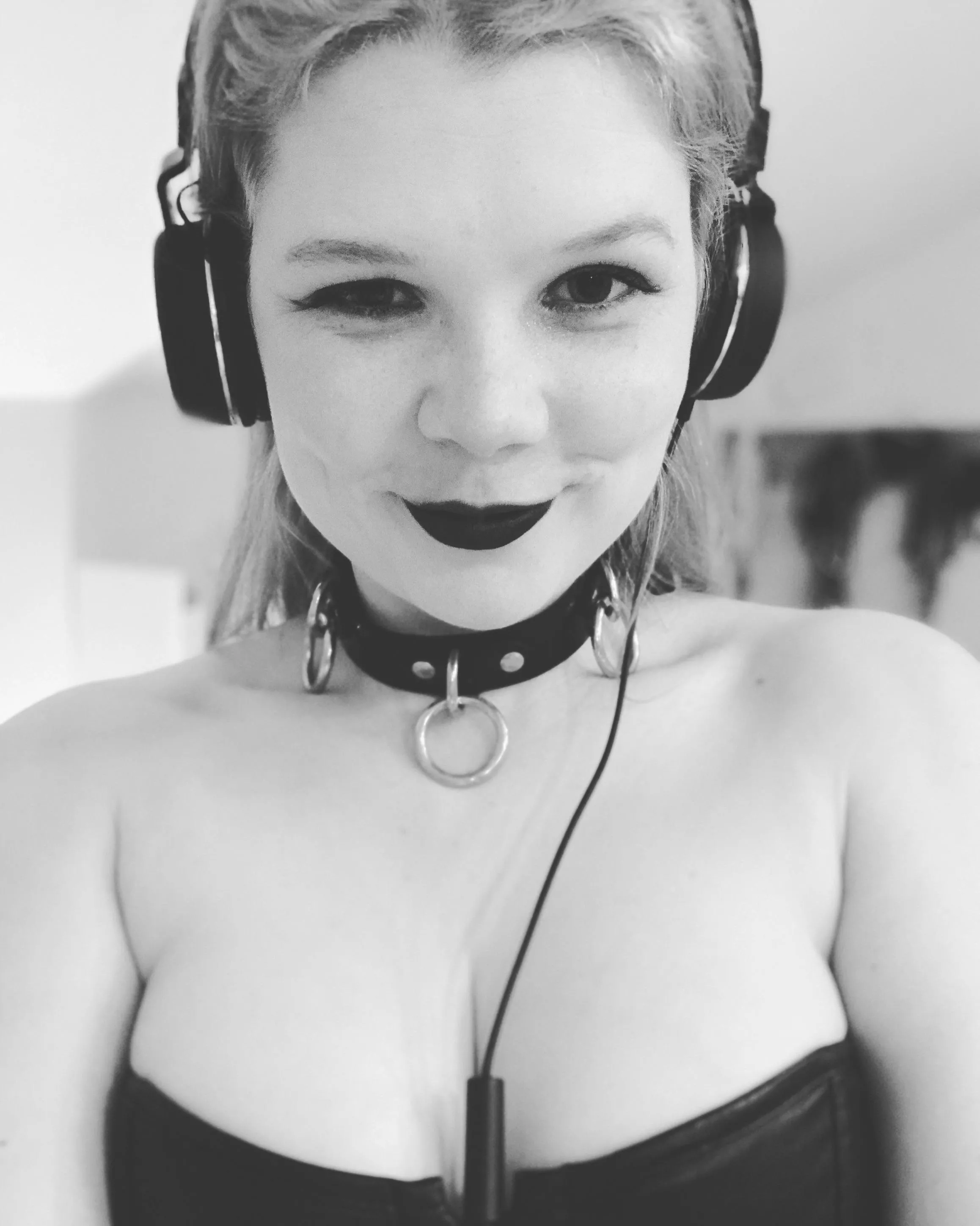 Collar, headphones, and a naughty smile