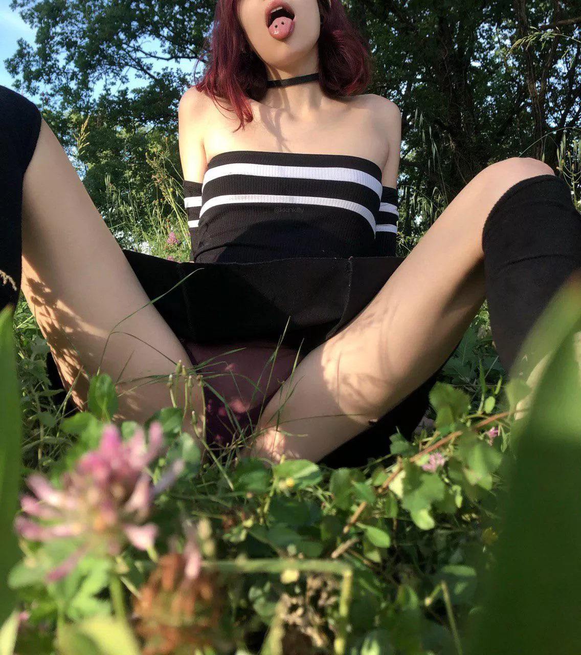 Collared and legs open in the woods