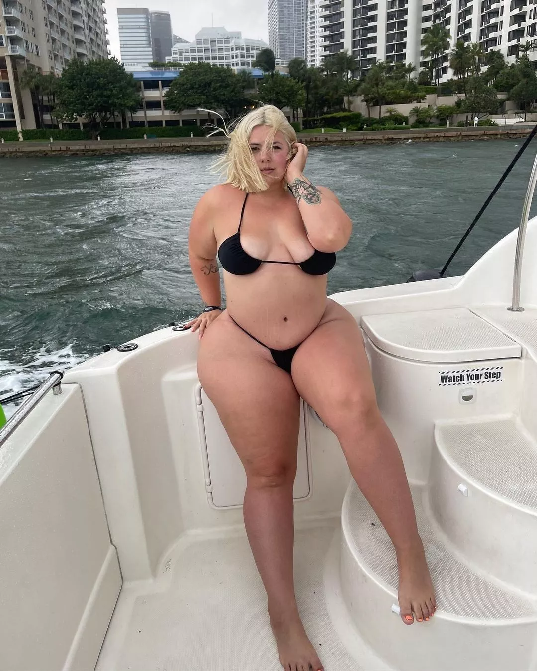 Curvy blonde on a boat