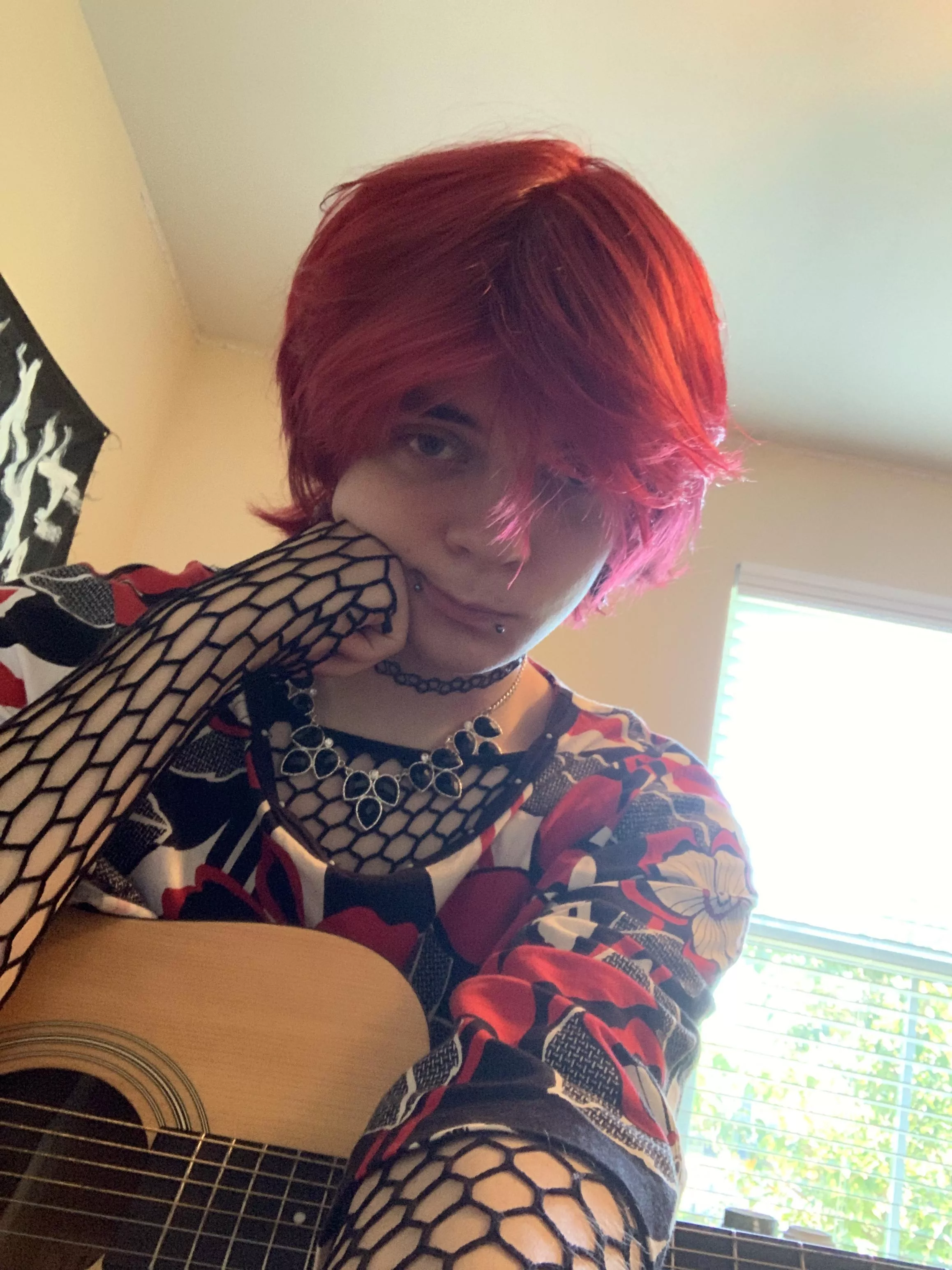 ENBY with a guitar