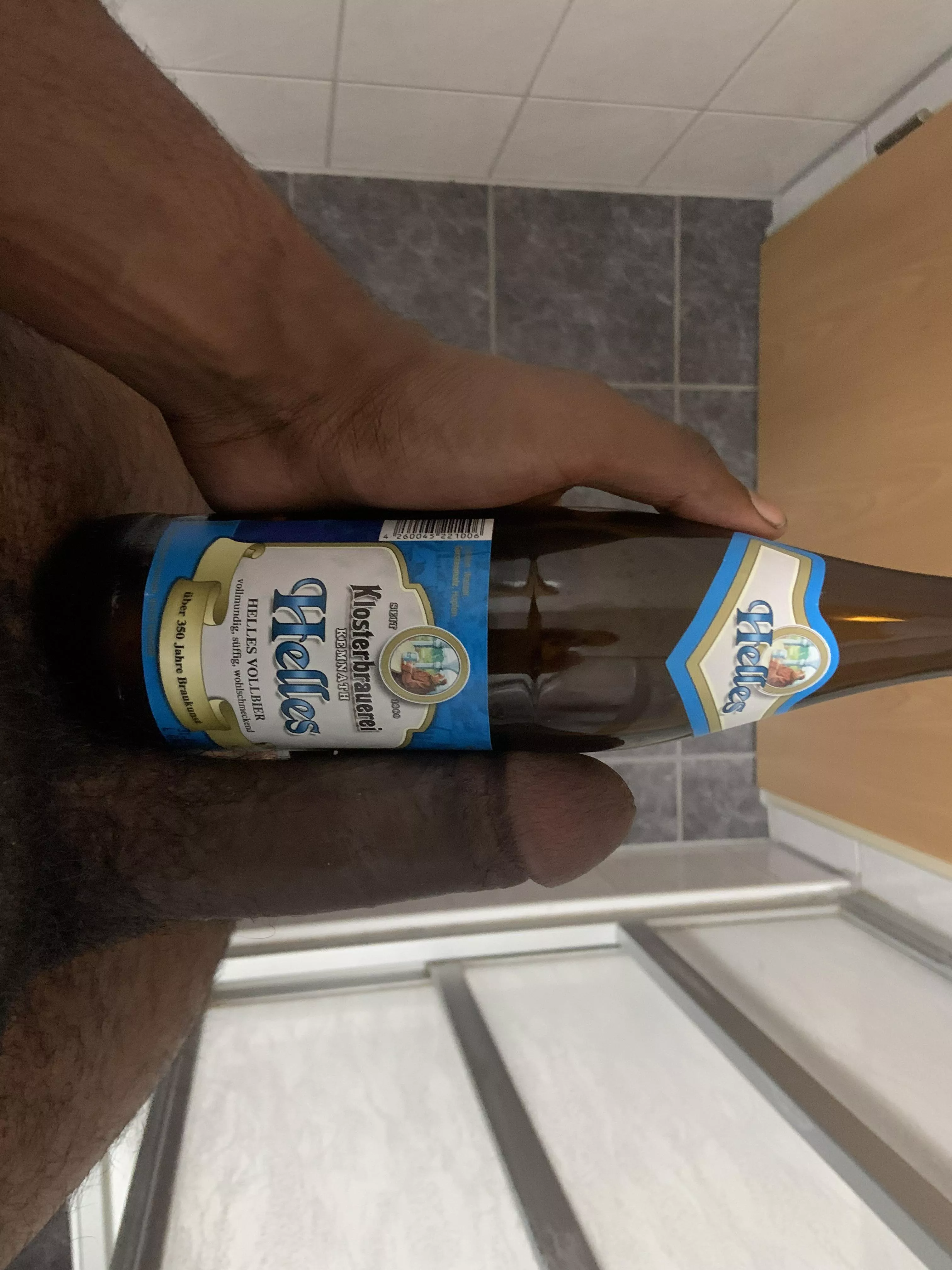 Flaccid dick next to a German beer. Maybe the next picture I’ll compare it while it’s hard.