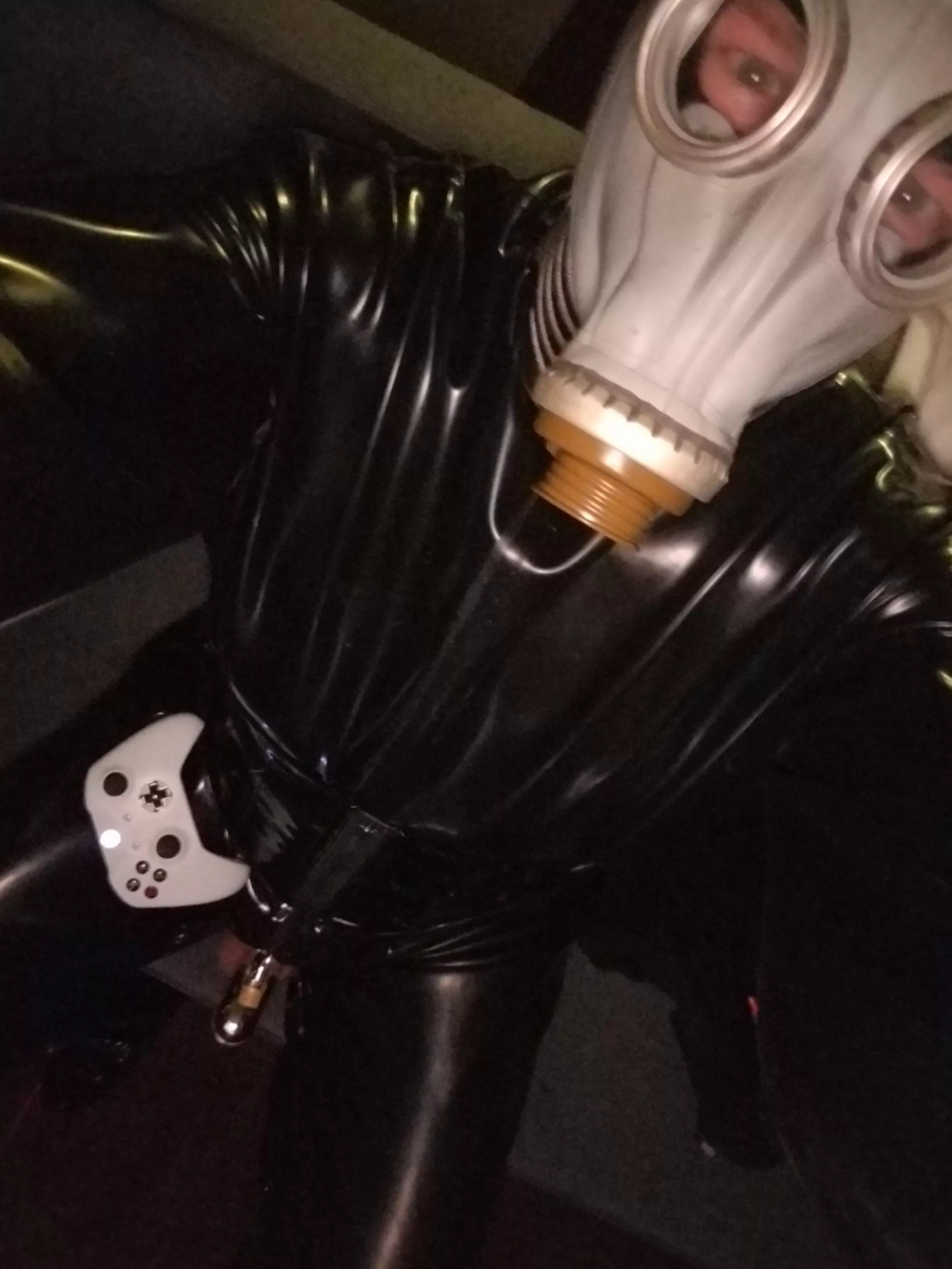 Gaming in heavy rubber and chastity.