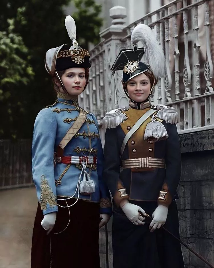 Grand Duchess Olga Nicholaievna of Russia in the uniform of her 3rd Elizavetgradsky Hussars Regiment with her sister Grand Duchess Tatiana Nicholeivna in 1911.