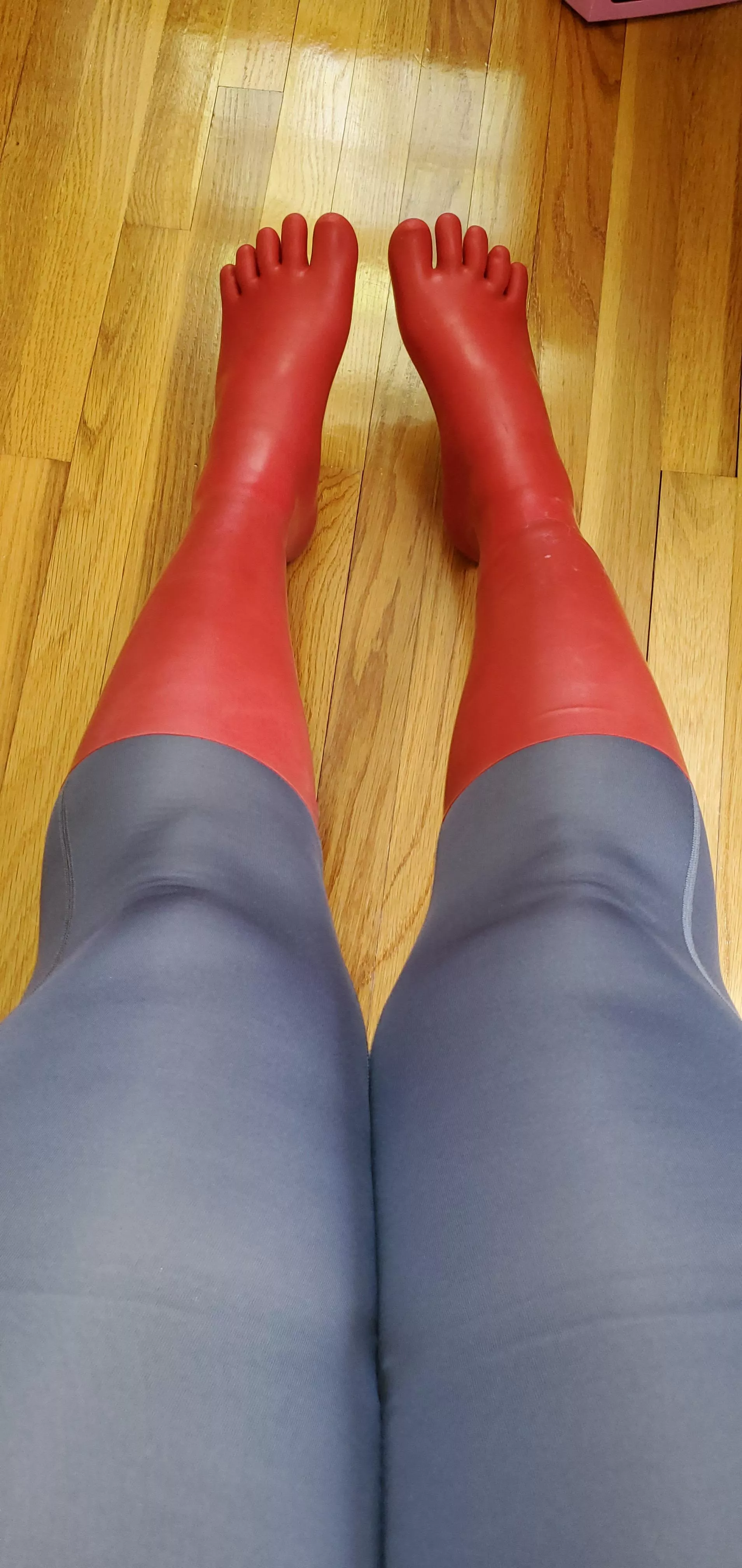 Gray tights and red latex toe socks