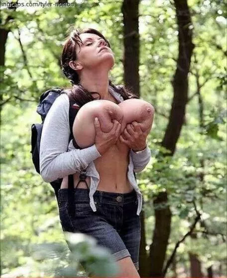 Holding her hangers in nature