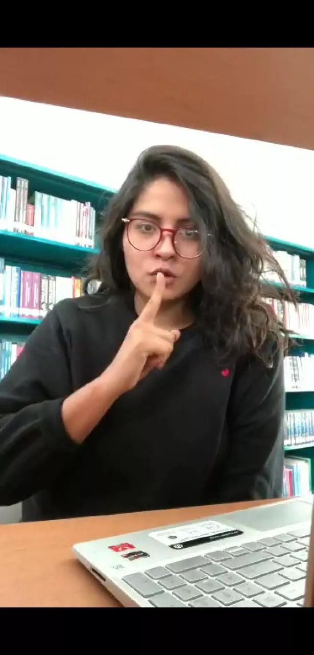 HOT GIRL SHOWING BOOBS IN LIBRARY