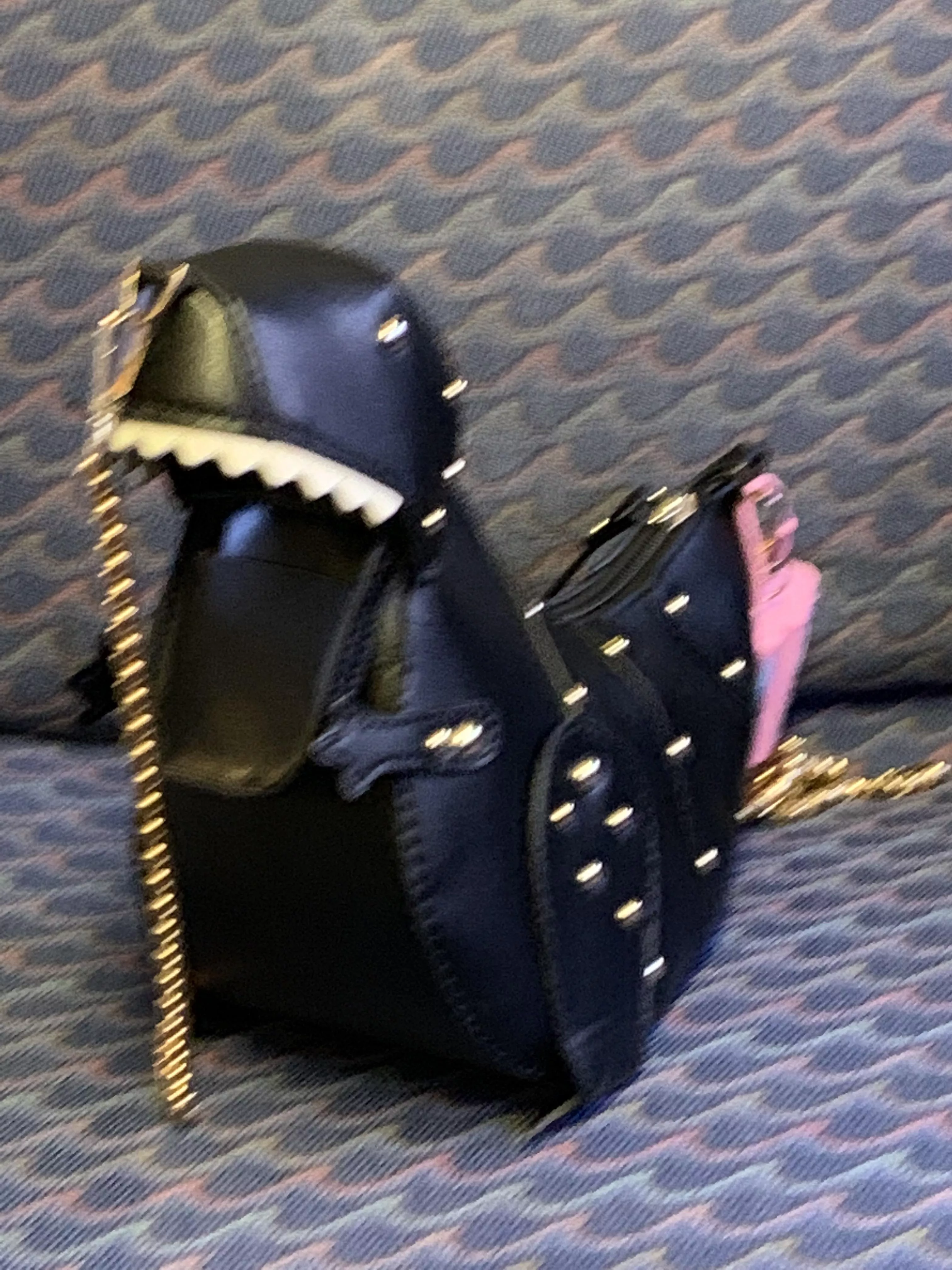 i was on the train and the conductor told me my purse looks like a BDSM dinosaur. i cant unsee it.