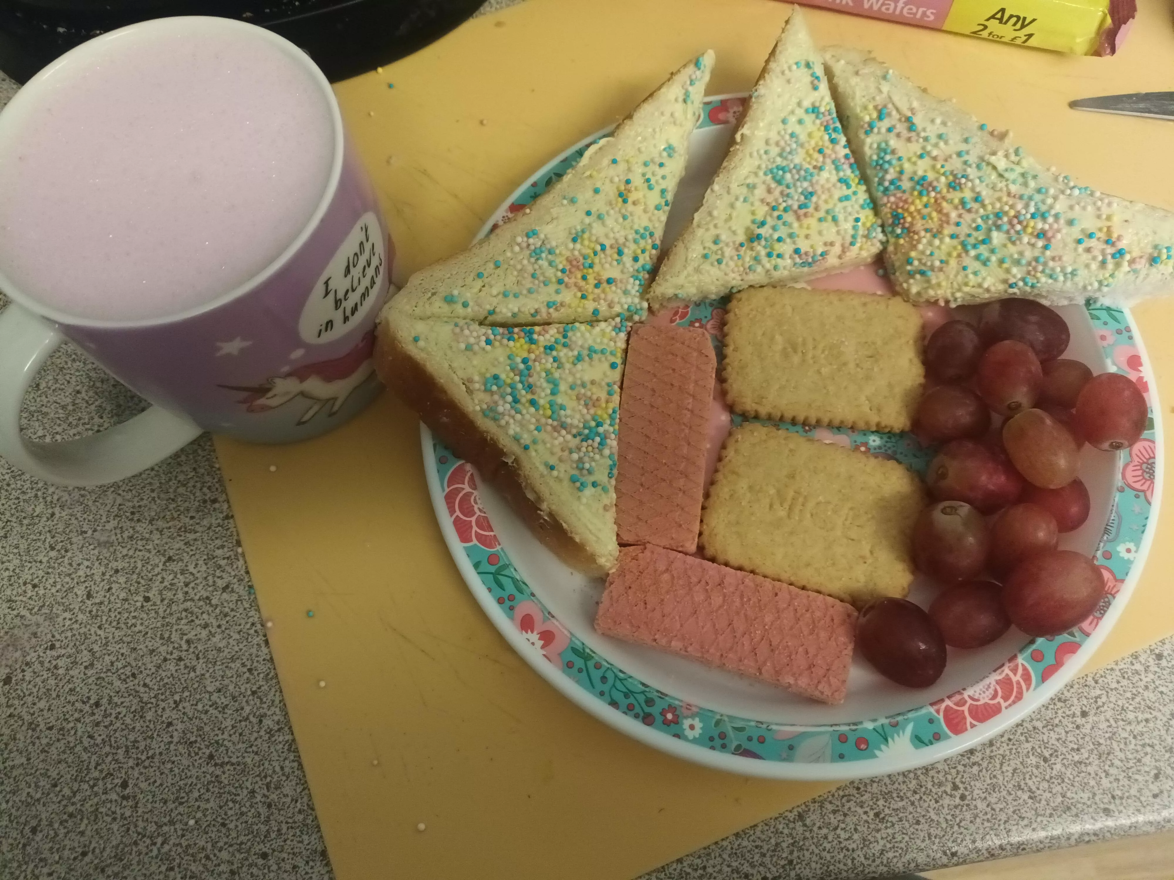 I've earnt the ultimate little breakfast! Spinkle bread, pink wafers, biscuits, grapes and bubblegum milkshake!