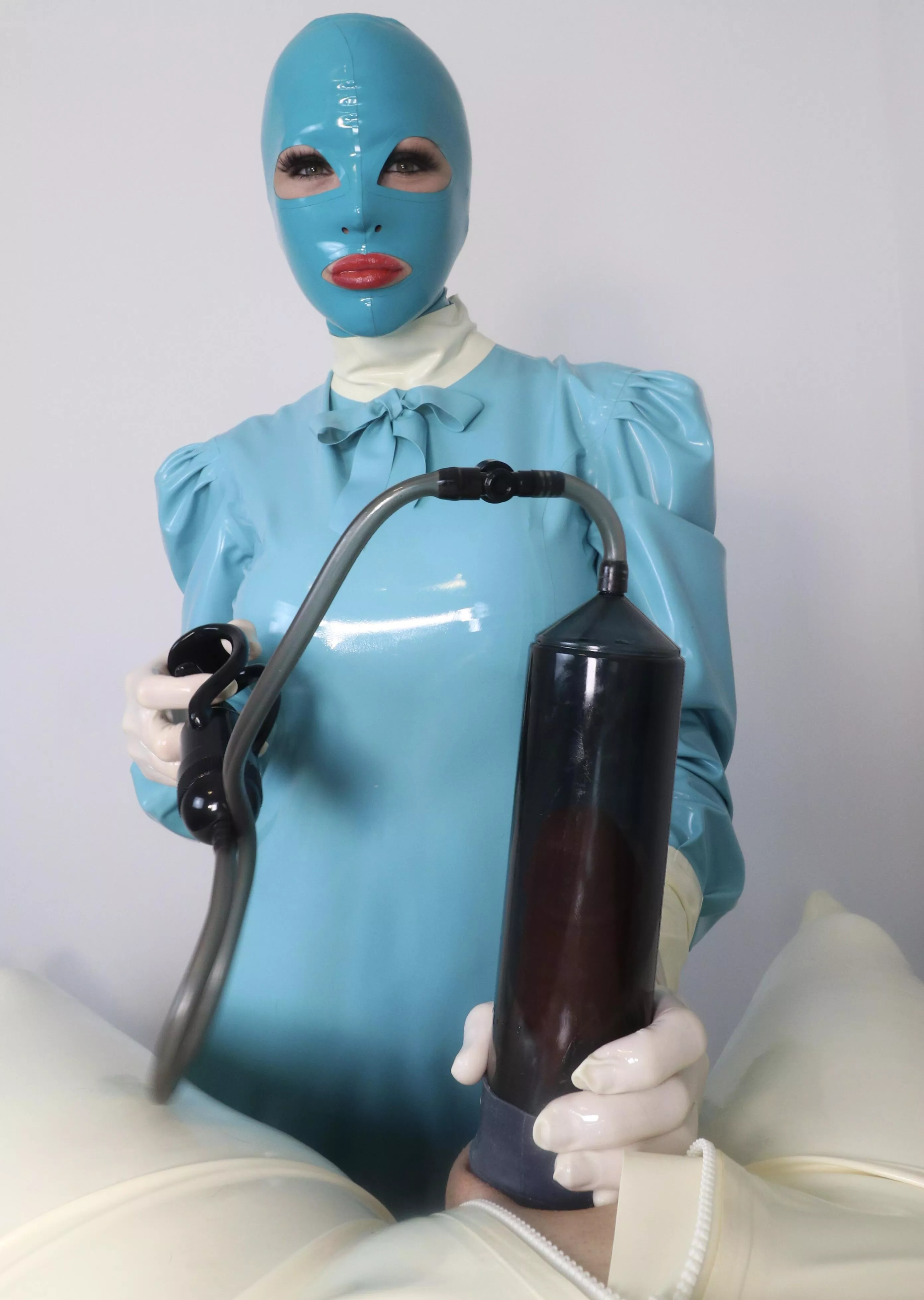 Latex Camille with a Penis Pump