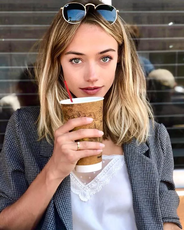 Livy Poulin has a dainty ring and a big cup of coffee